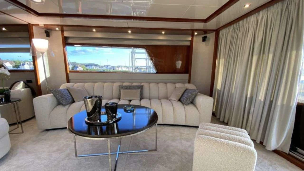 a living room with a couch and a table aboard MAMMA'S Yacht for Charter