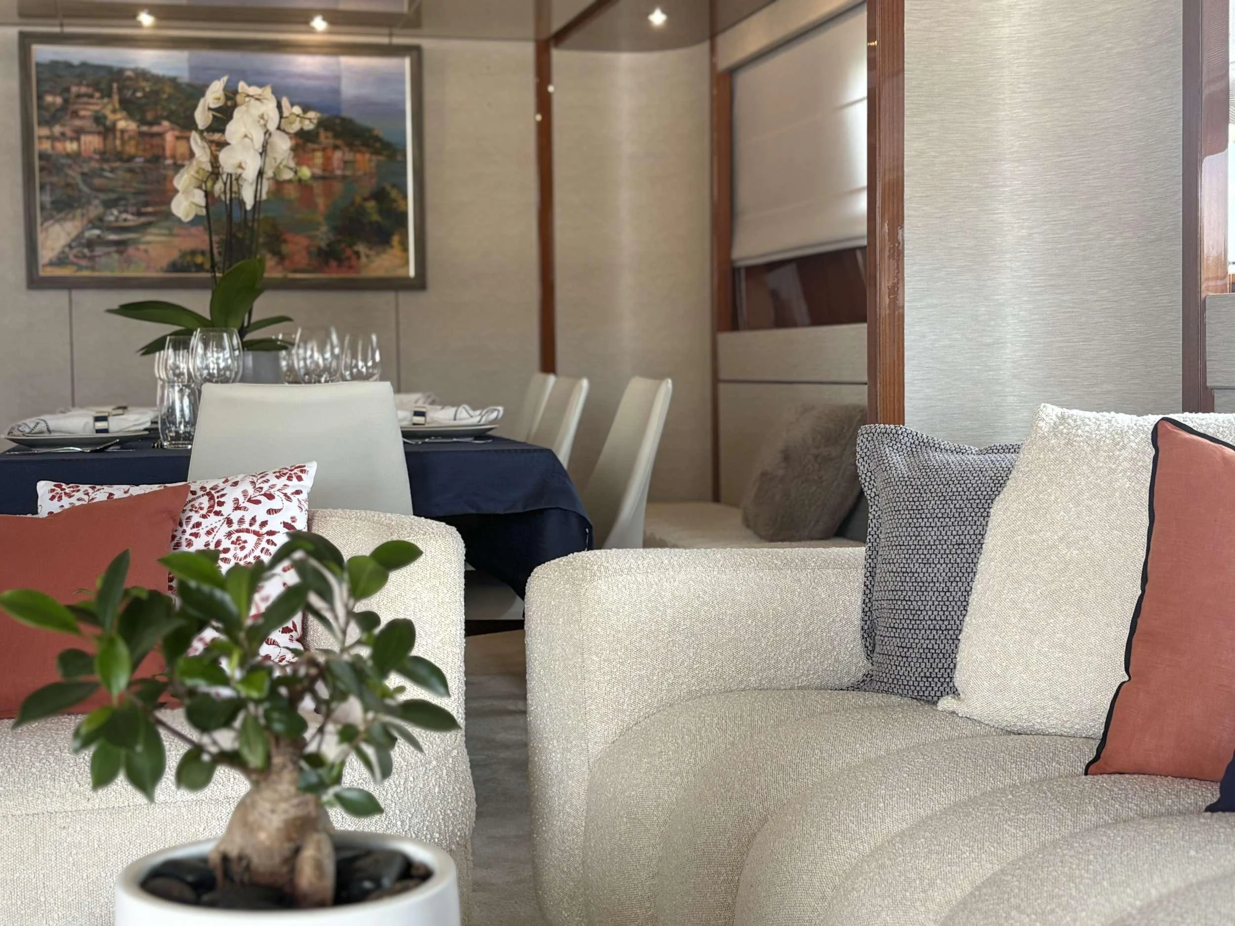 a living room with a couch and a table aboard MAMMA'S Yacht for Charter
