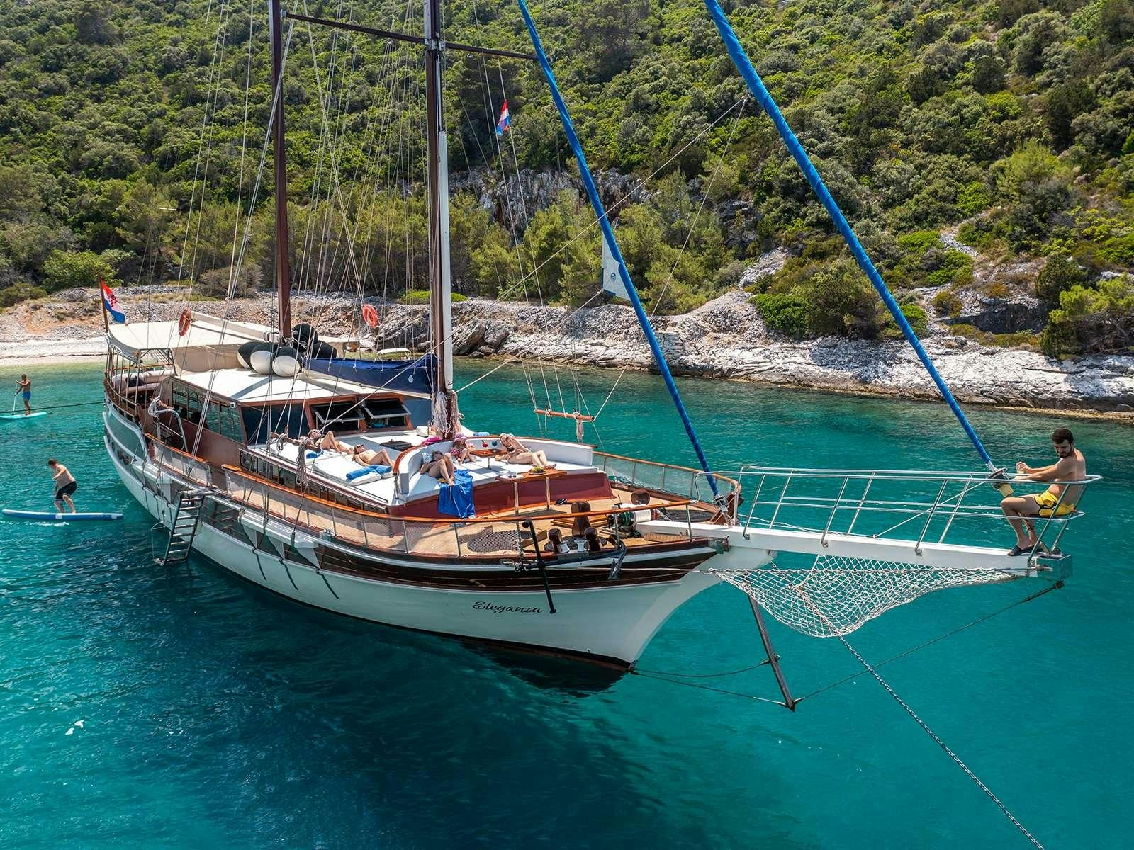 a boat sailing on the water aboard ELEGANZA Yacht for Charter