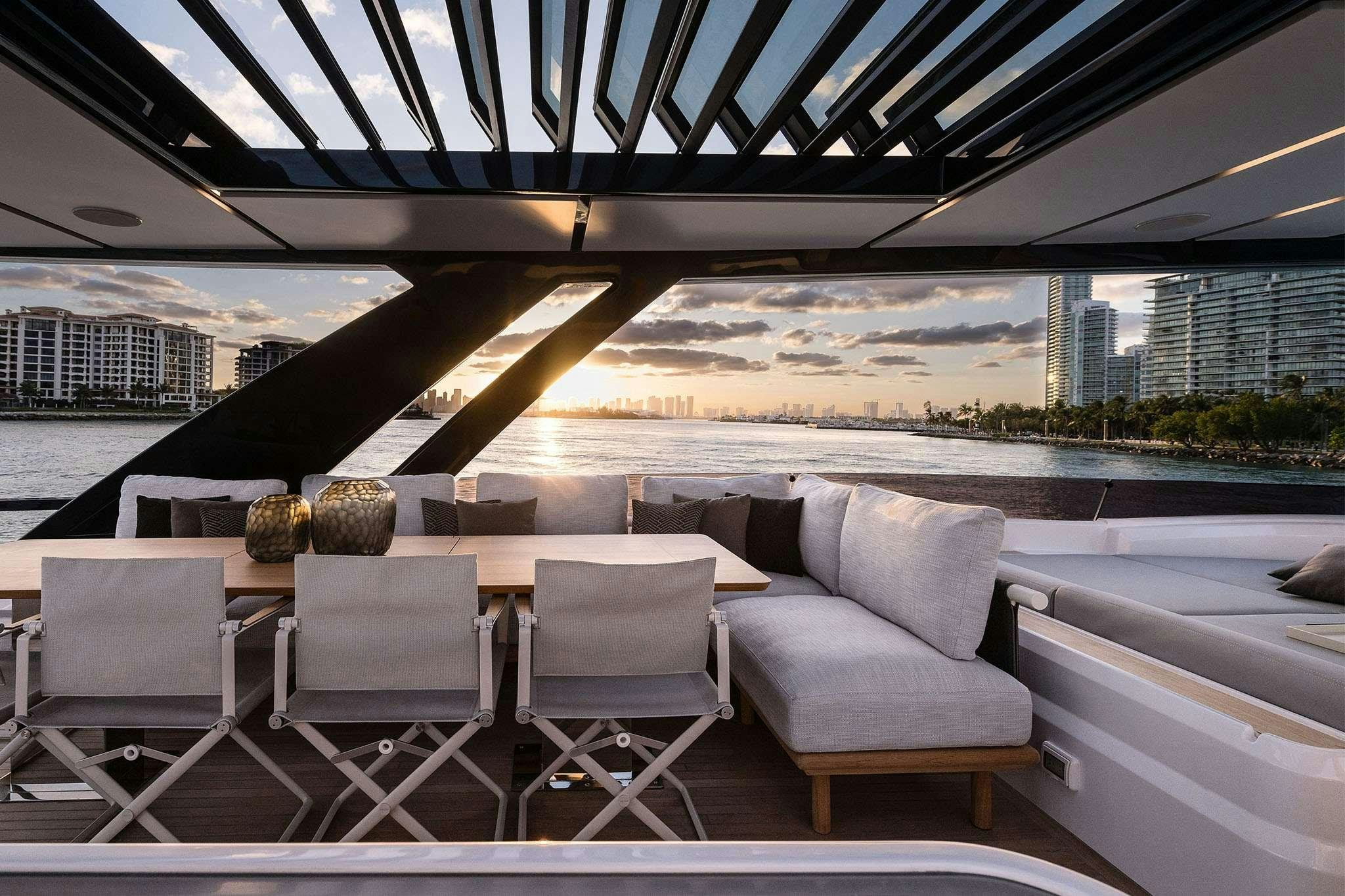 a large outdoor table with chairs on it aboard FAST Yacht for Charter