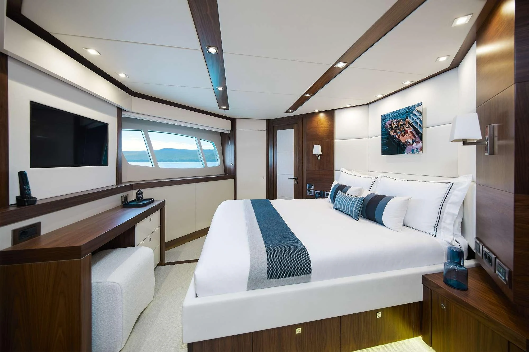 a room with a bed and a desk aboard GEORGE P Yacht for Charter