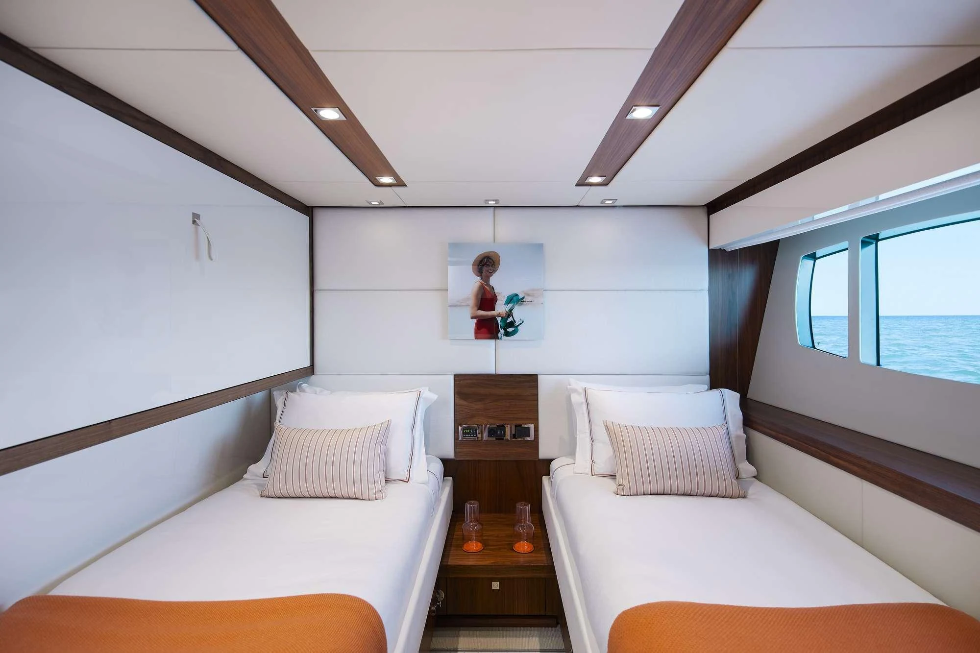 a room with a bed and a mirror aboard GEORGE P Yacht for Charter