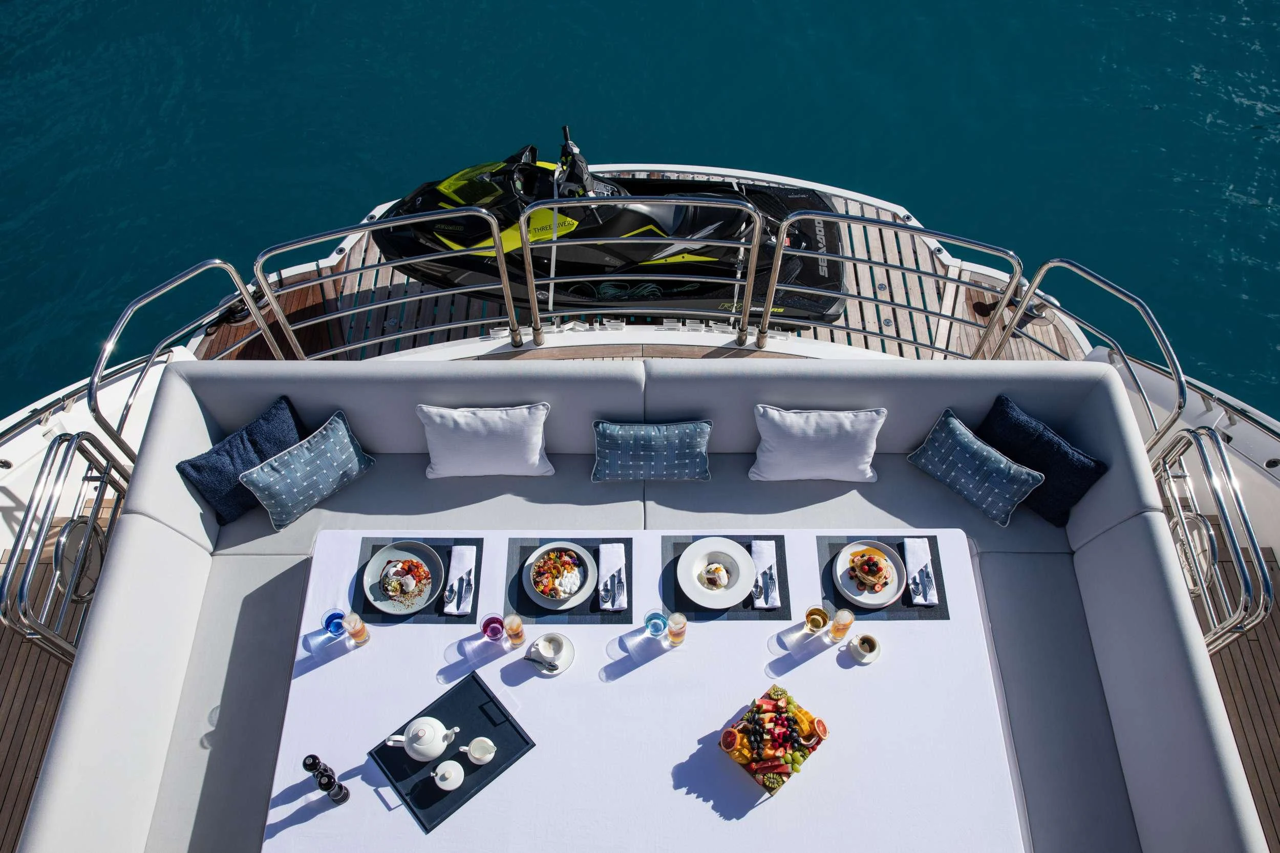 a white boat with a black and white design on it aboard GEORGE P Yacht for Charter