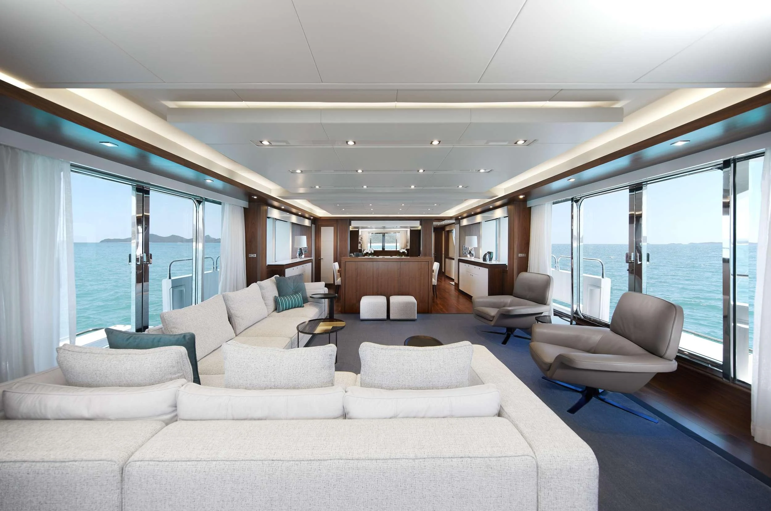 a living room with a large window aboard GEORGE P Yacht for Charter