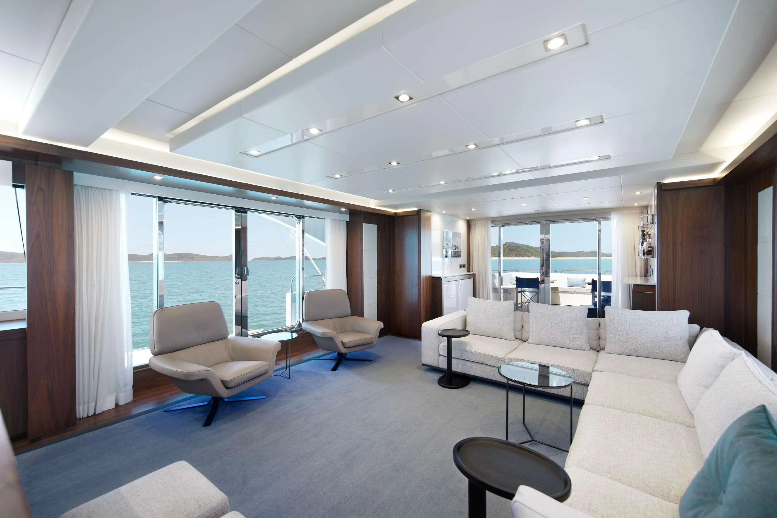 a living room with a large window aboard GEORGE P Yacht for Charter