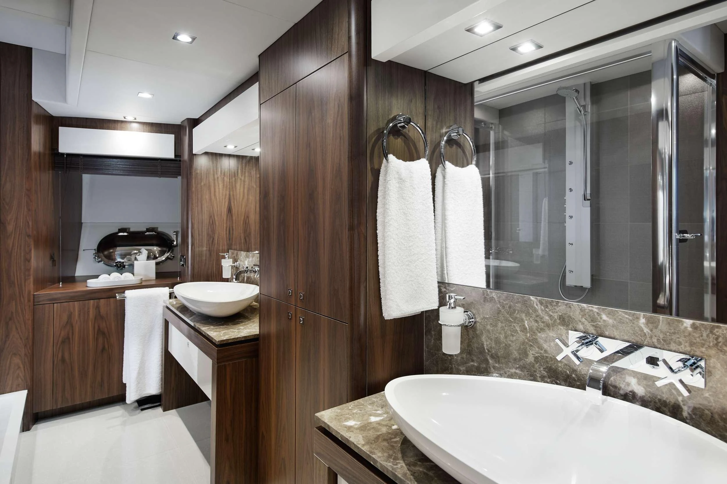 a bathroom with a large mirror aboard GEORGE P Yacht for Charter