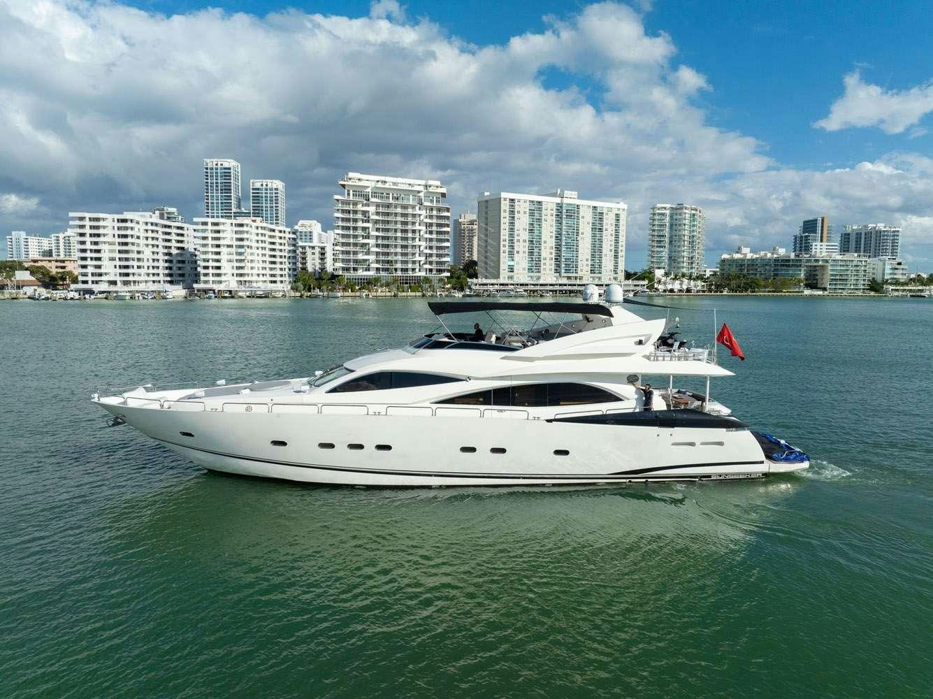 a white yacht in the water aboard SO WHAT WHO CARES Yacht for Charter