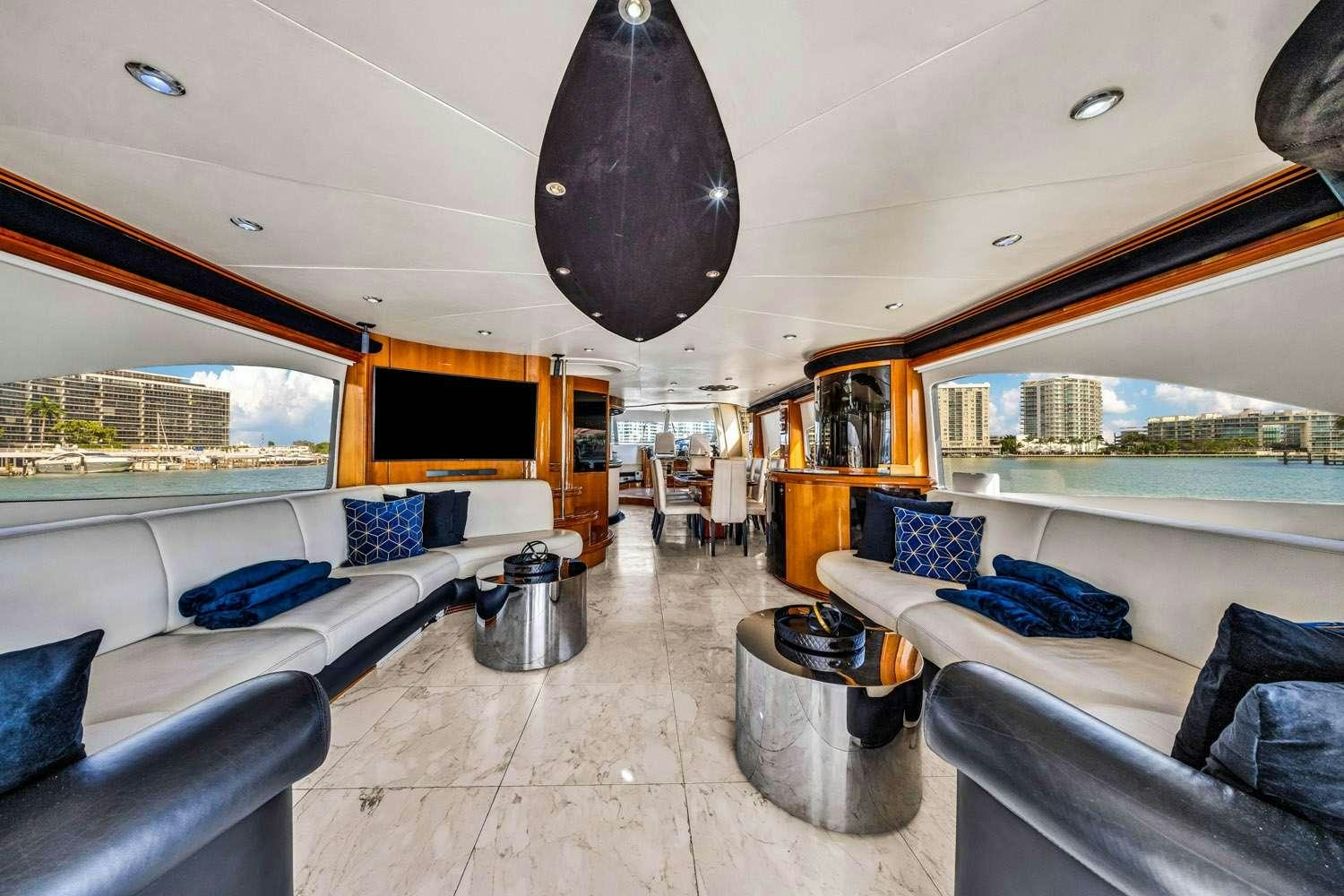 a room with a couch and a table and a large balloon aboard SO WHAT WHO CARES Yacht for Charter