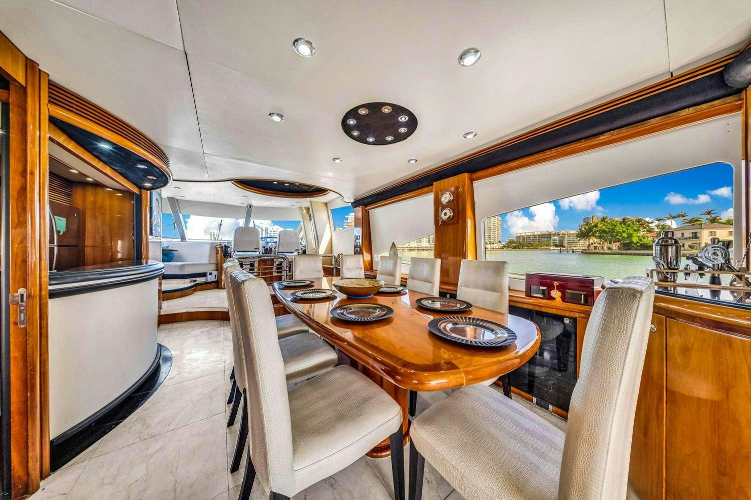 a dining table in a train car aboard SO WHAT WHO CARES Yacht for Charter