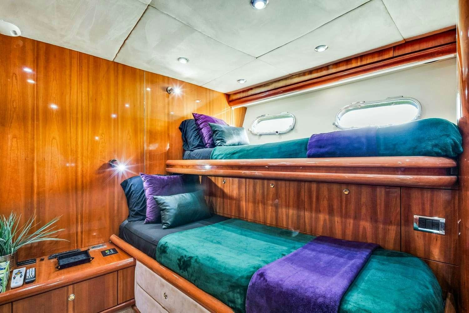 a couch with a blue blanket aboard SO WHAT WHO CARES Yacht for Charter