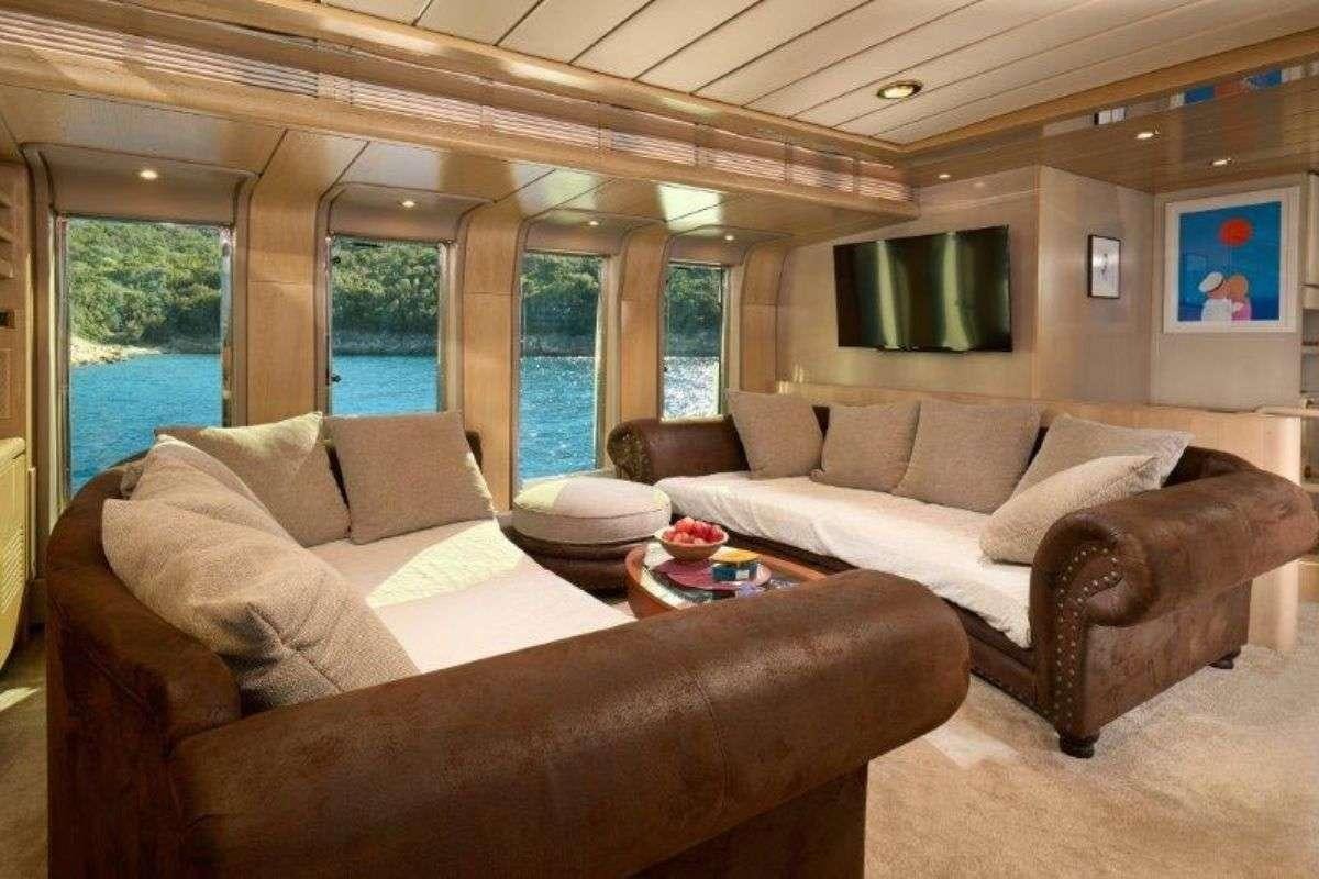 a living room with a couch and a table aboard MARSHALL Yacht for Charter