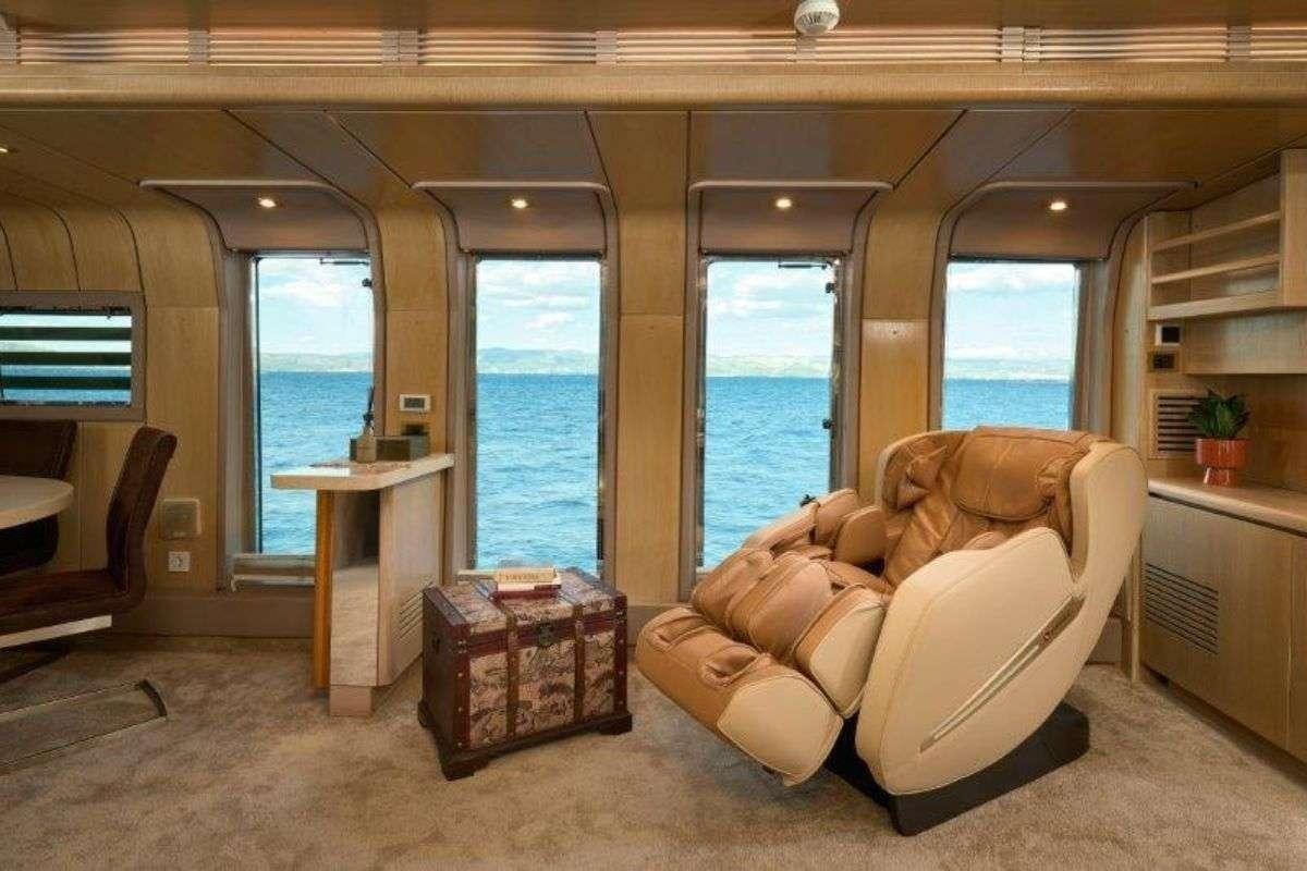 a living room with a large window aboard MARSHALL Yacht for Charter