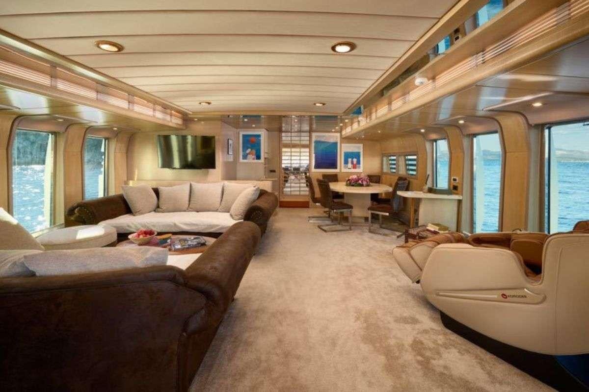 a living room with a couch and a tv aboard MARSHALL Yacht for Charter