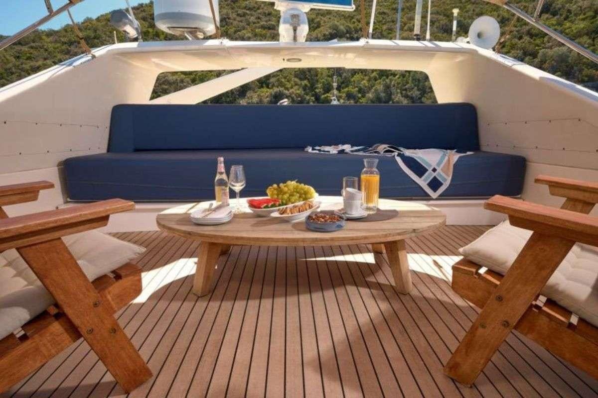 a patio with a table and chairs aboard MARSHALL Yacht for Charter