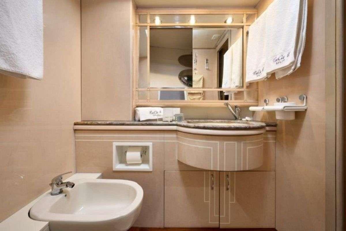 a bathroom with a sink and a mirror aboard MARSHALL Yacht for Charter