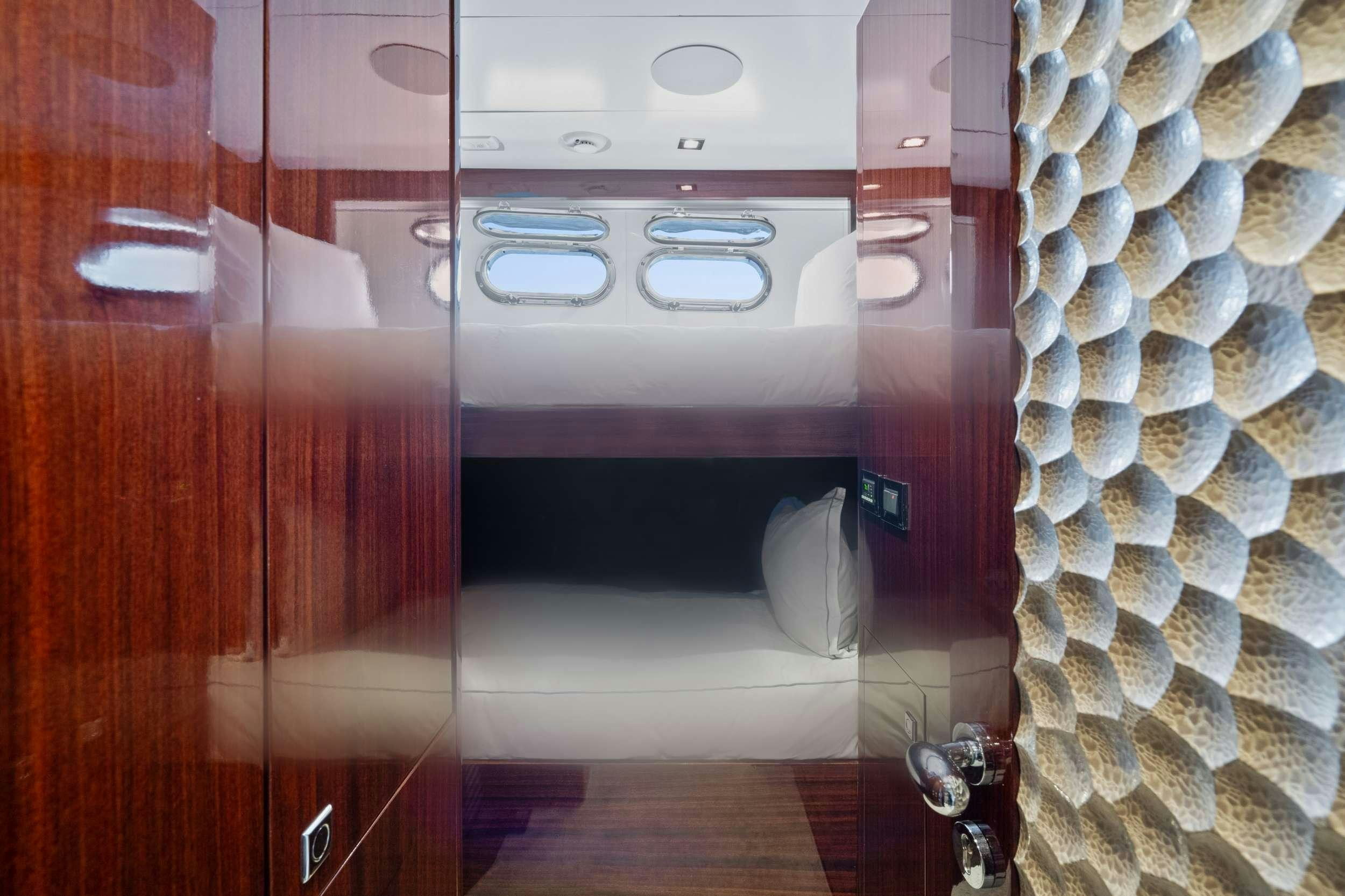 a room with a mirror and a sink aboard PILOT LOUNGE Yacht for Charter