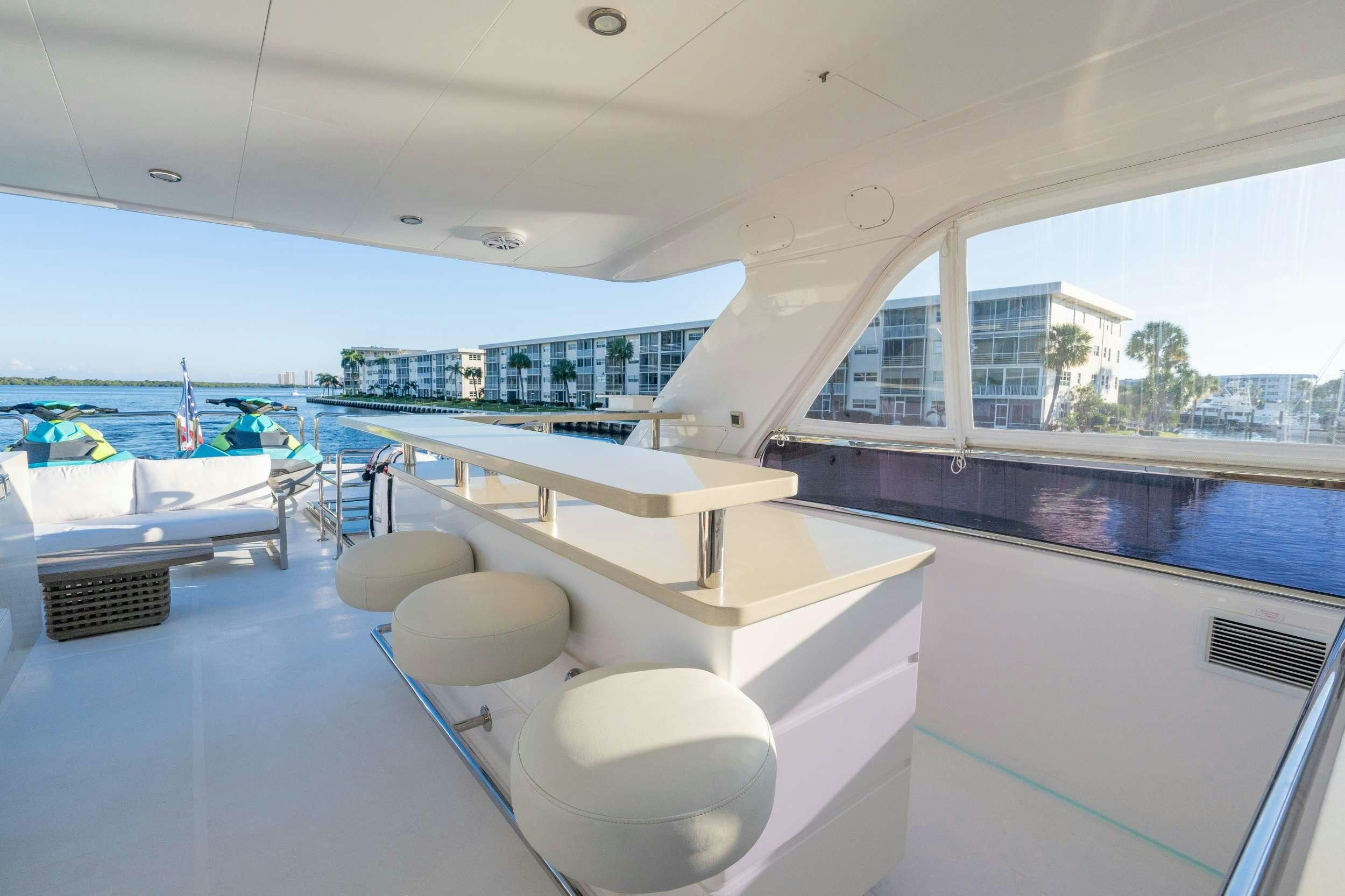 a room with a pool and a large window aboard PILOT LOUNGE Yacht for Charter