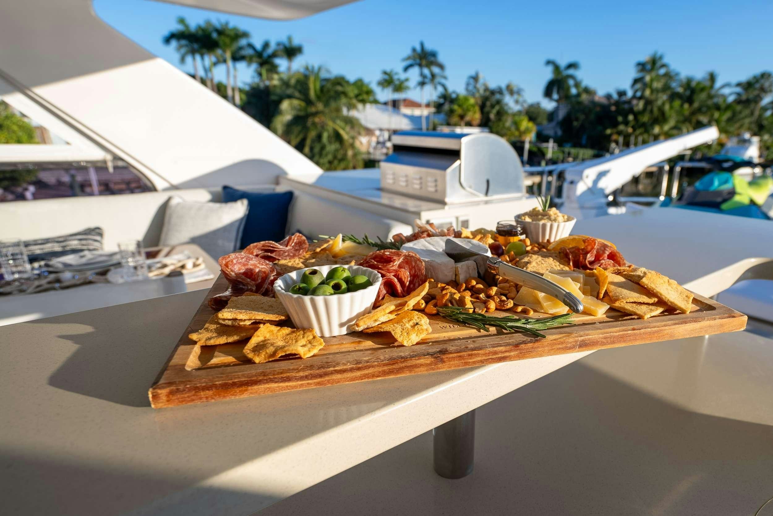 a table with food on it aboard PILOT LOUNGE Yacht for Charter