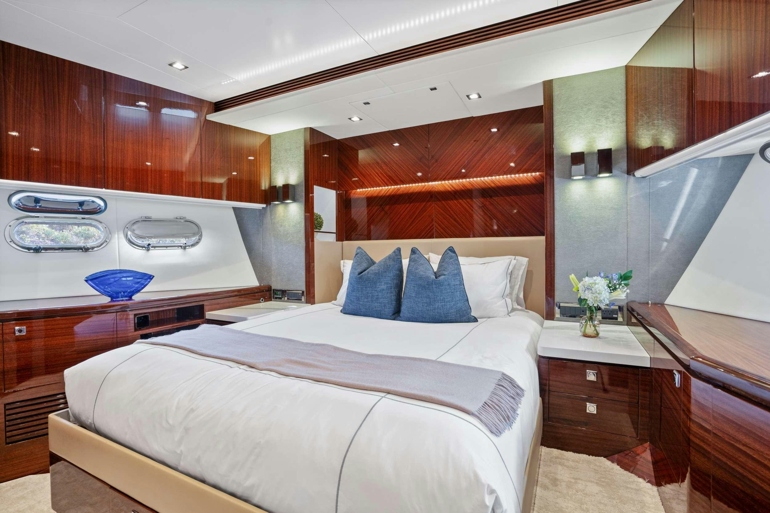 a bedroom with a bed aboard PILOT LOUNGE Yacht for Charter