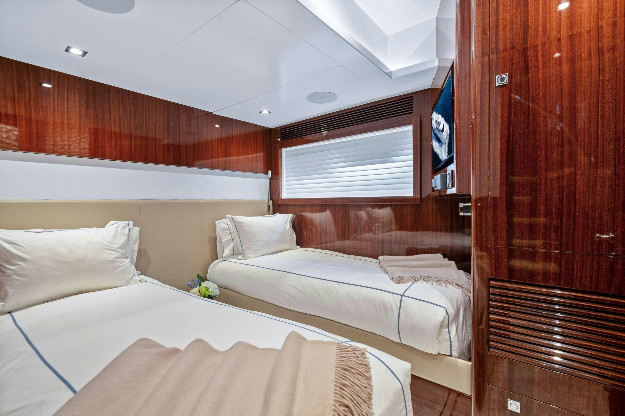 a room with two beds aboard PILOT LOUNGE Yacht for Charter