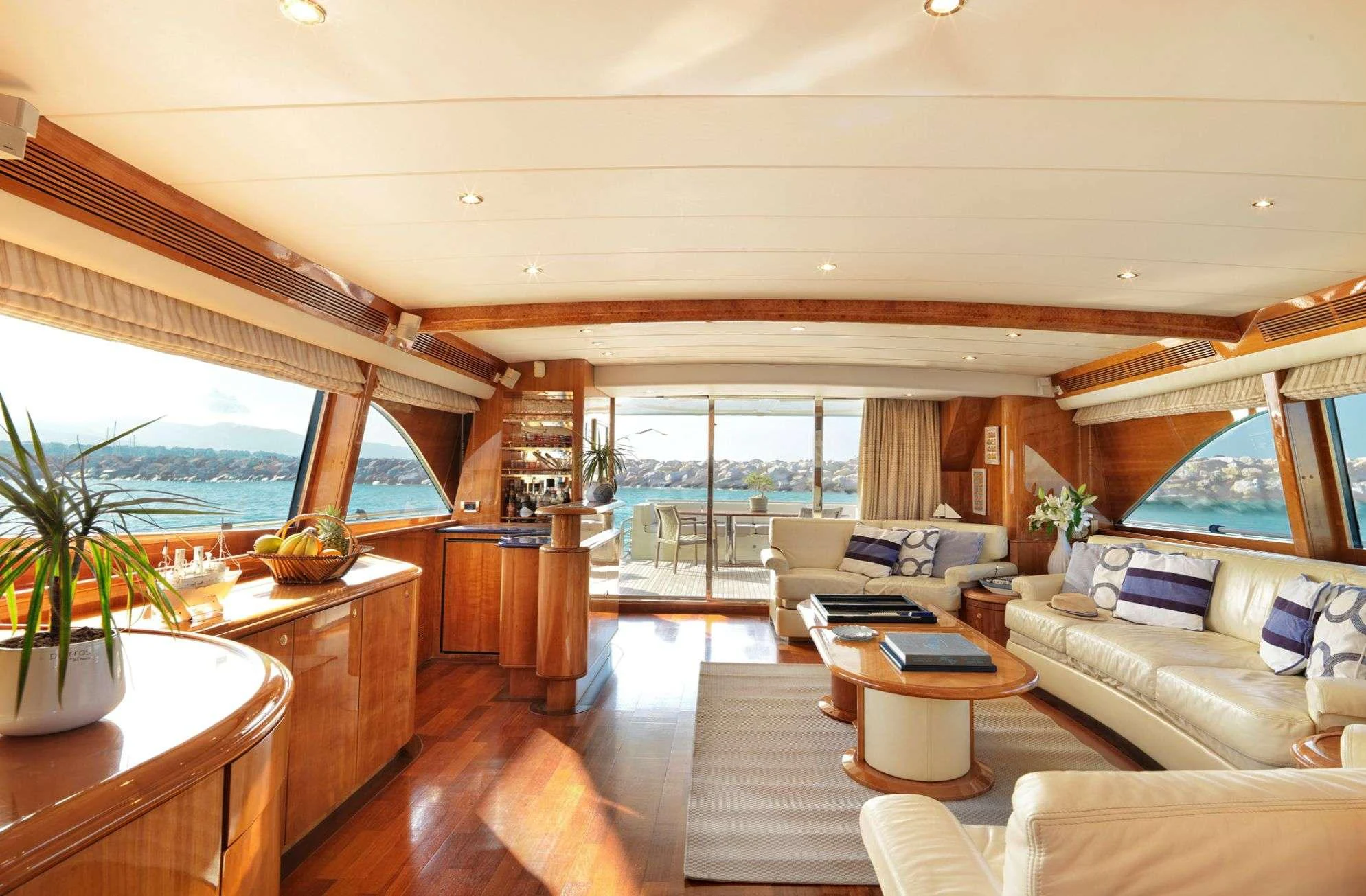a living room with a large window aboard ATALANTI Yacht for Charter