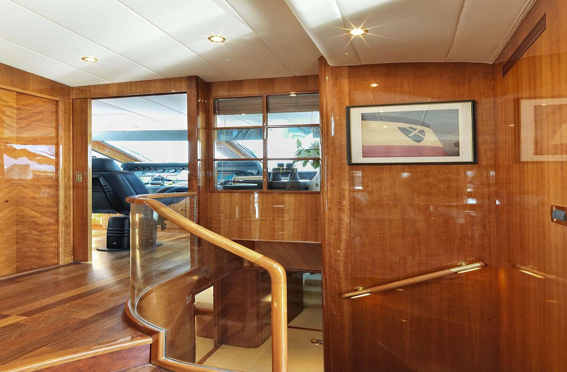 a room with a wood door and a window with a wood paneled wall and a wood door aboard ATALANTI Yacht for Charter