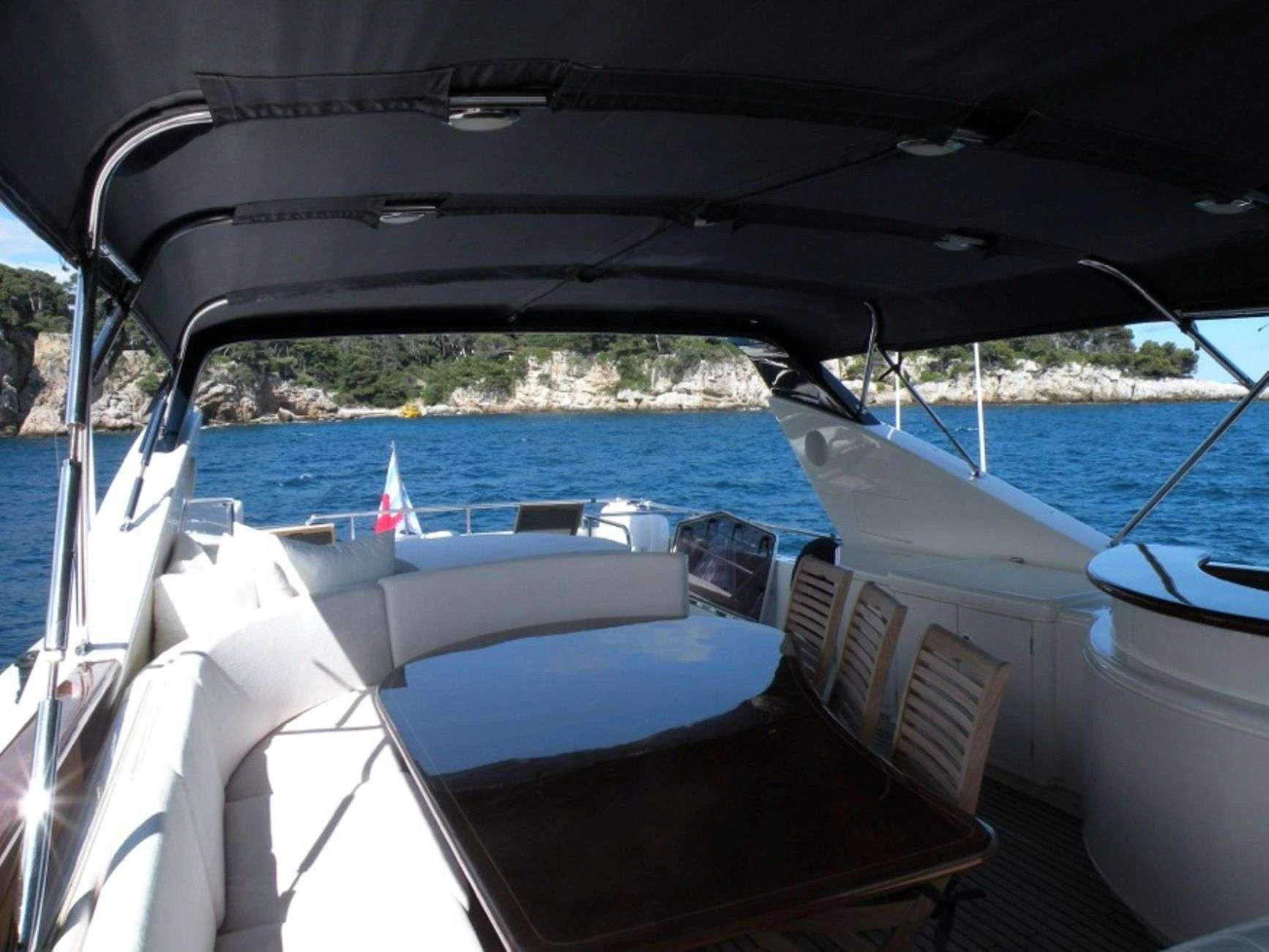 a boat is parked in the water aboard ATALANTI Yacht for Charter