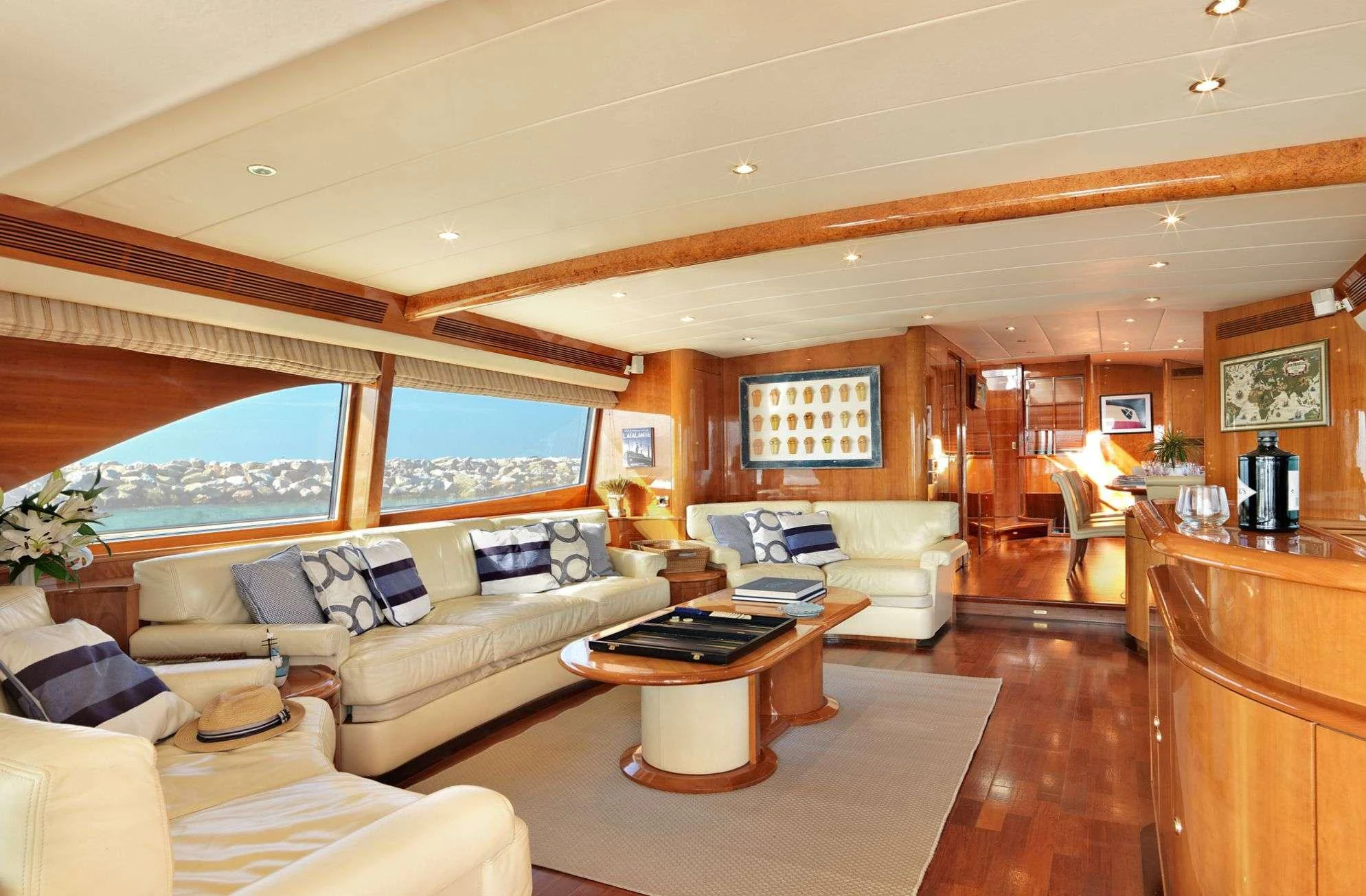 a living room with a large window aboard ATALANTI Yacht for Charter