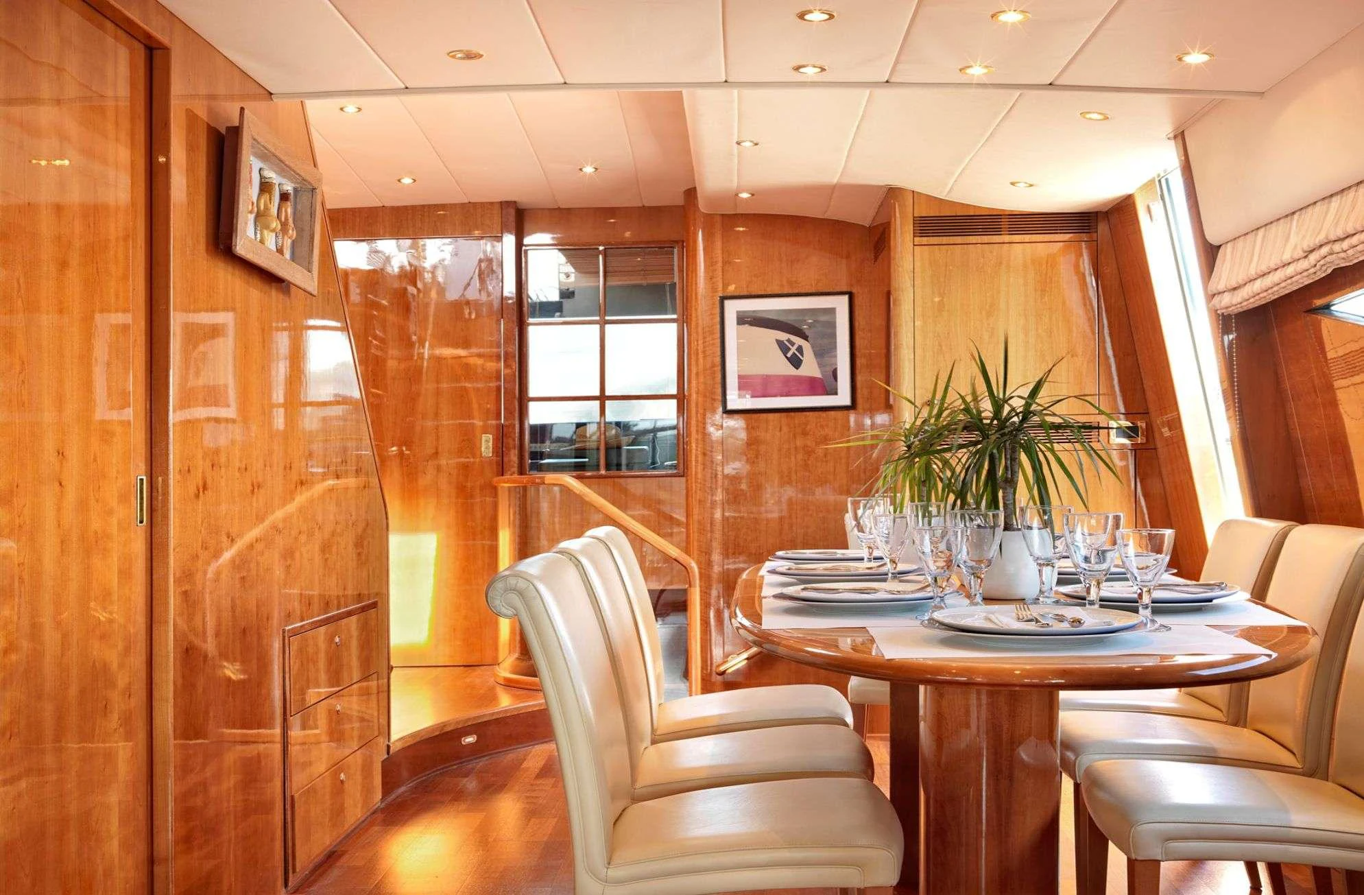 a dining room with a table and chairs aboard ATALANTI Yacht for Charter