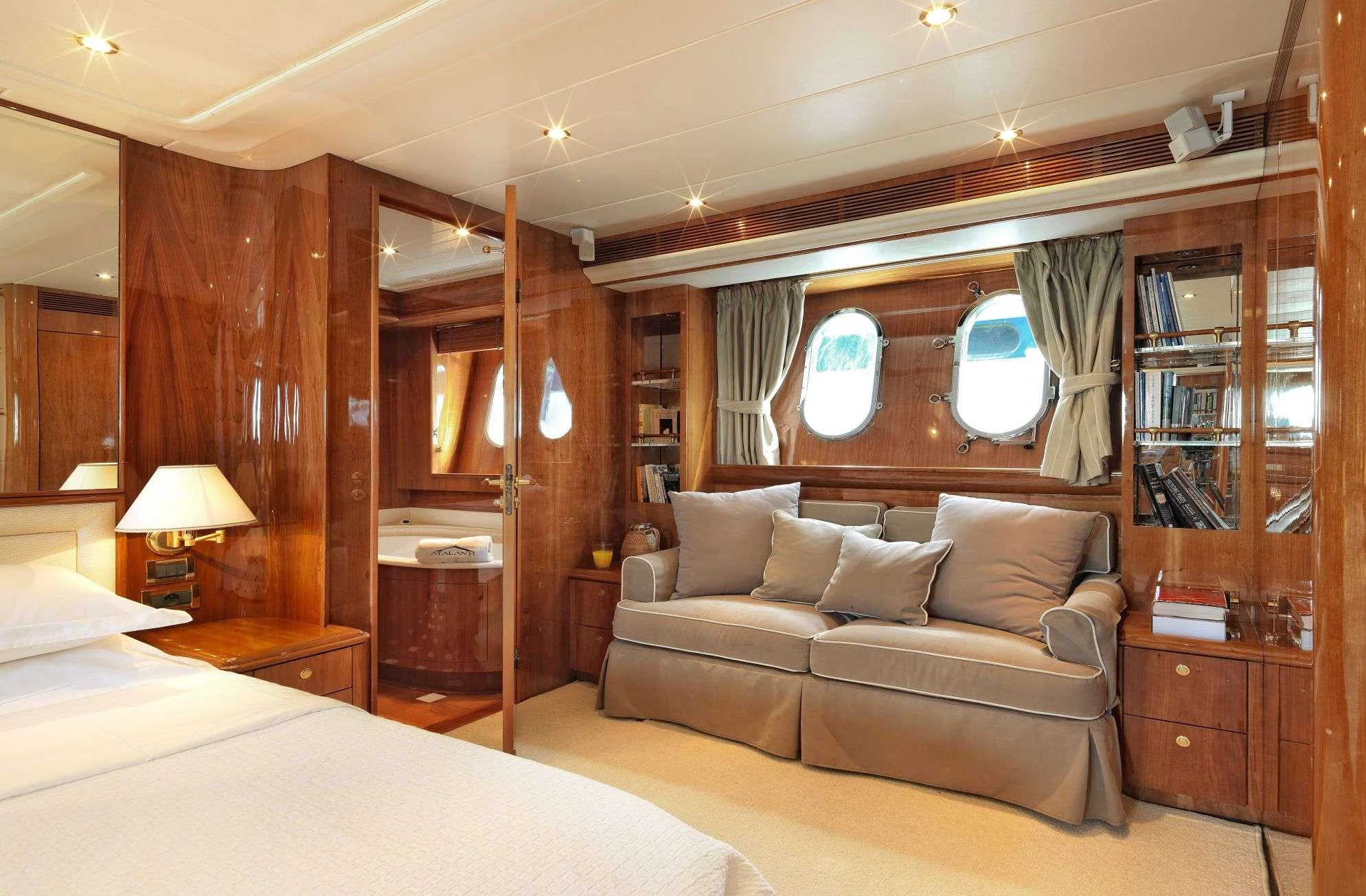 a room with a bed and a window aboard ATALANTI Yacht for Charter