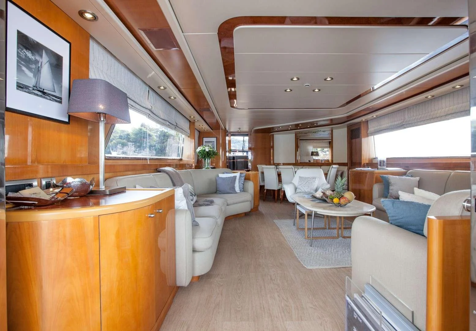 a living room with a large window aboard SOLAL Yacht for Charter