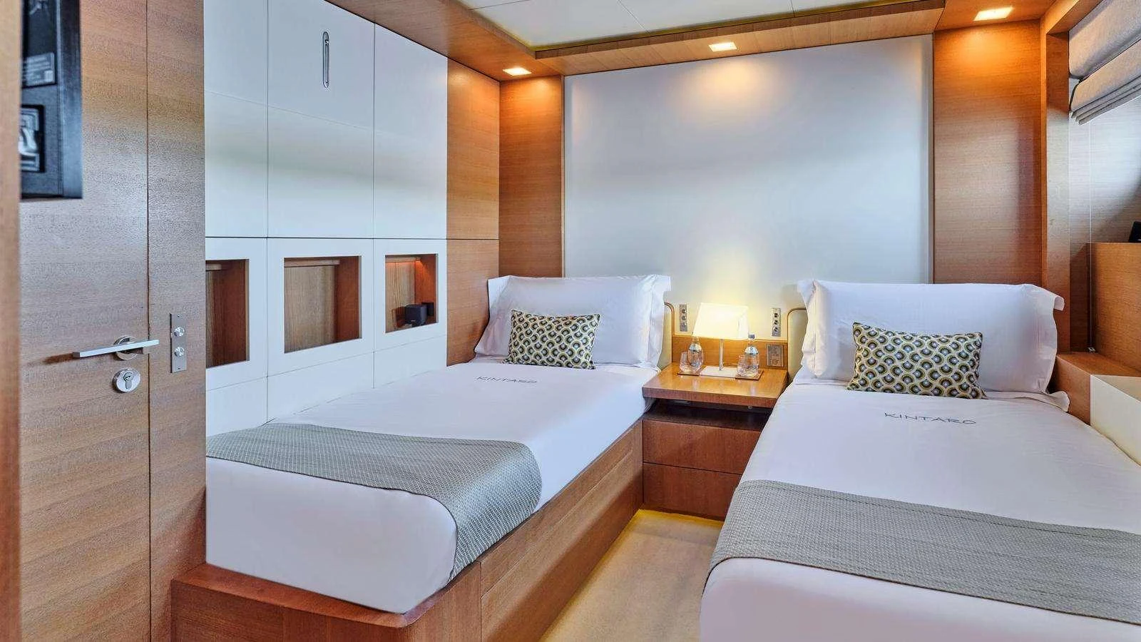 a room with two beds aboard KINTARO Yacht for Charter