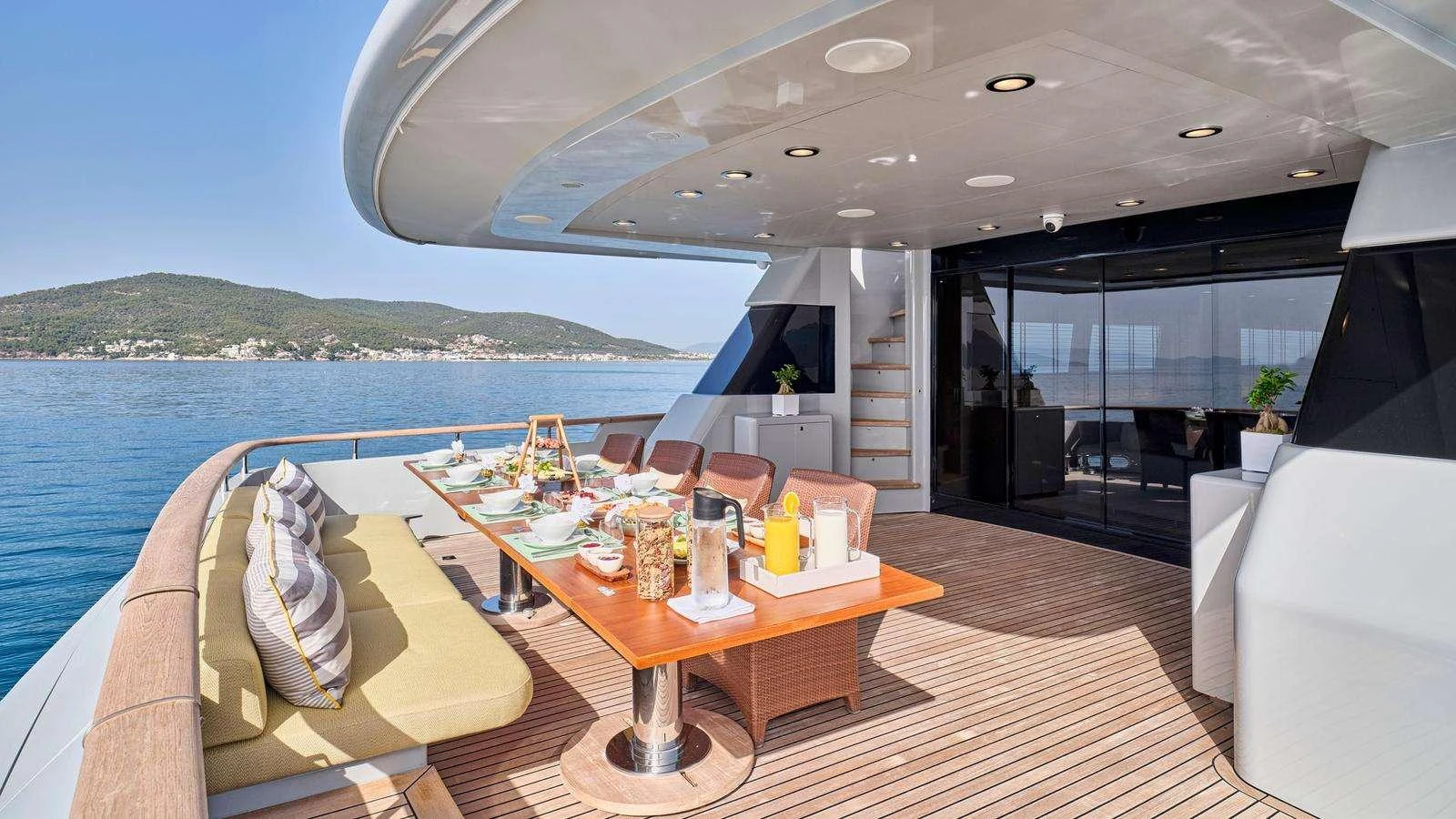 a room with a table and chairs aboard KINTARO Yacht for Charter