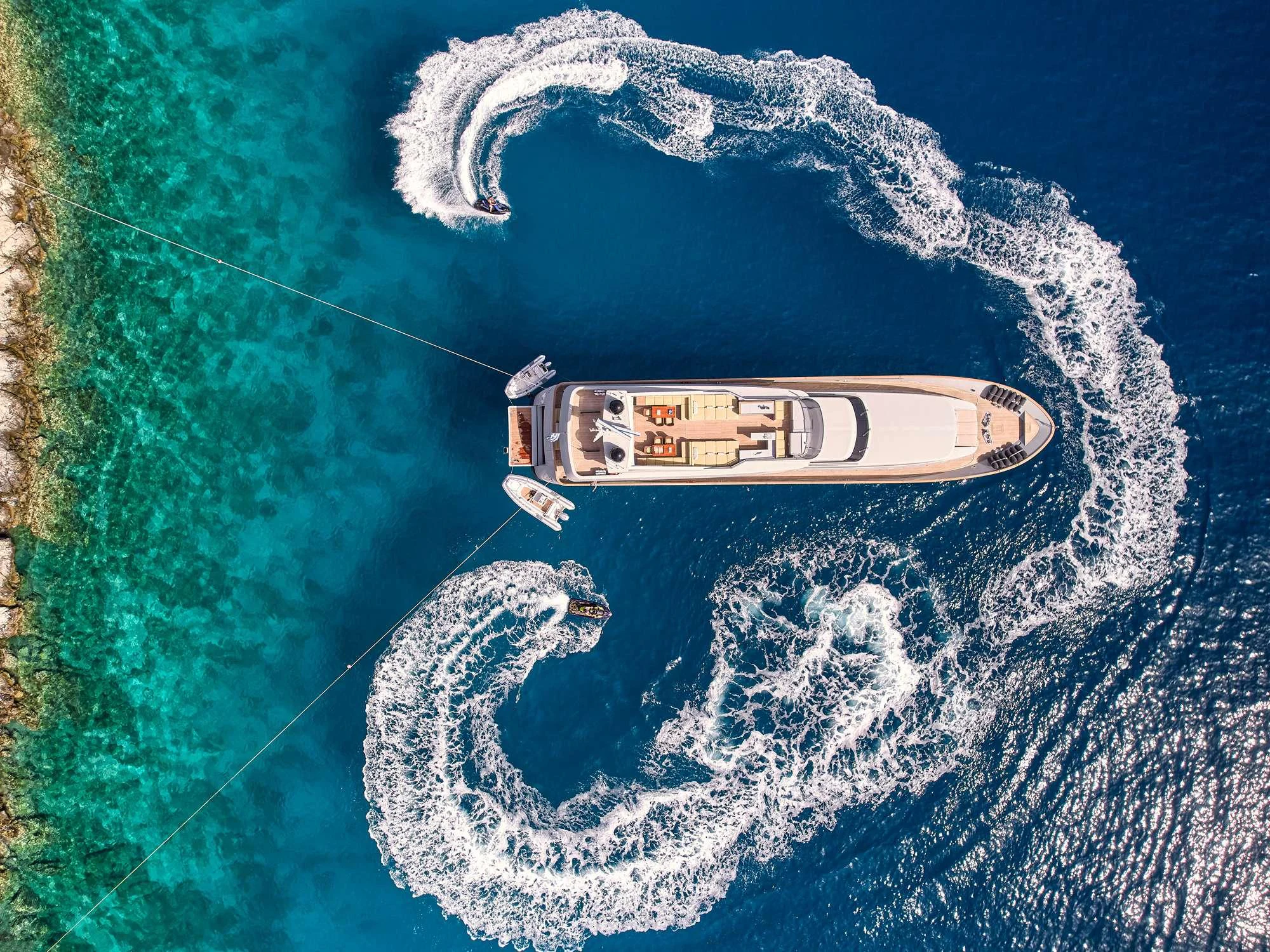 a small boat in the water aboard KINTARO Yacht for Charter