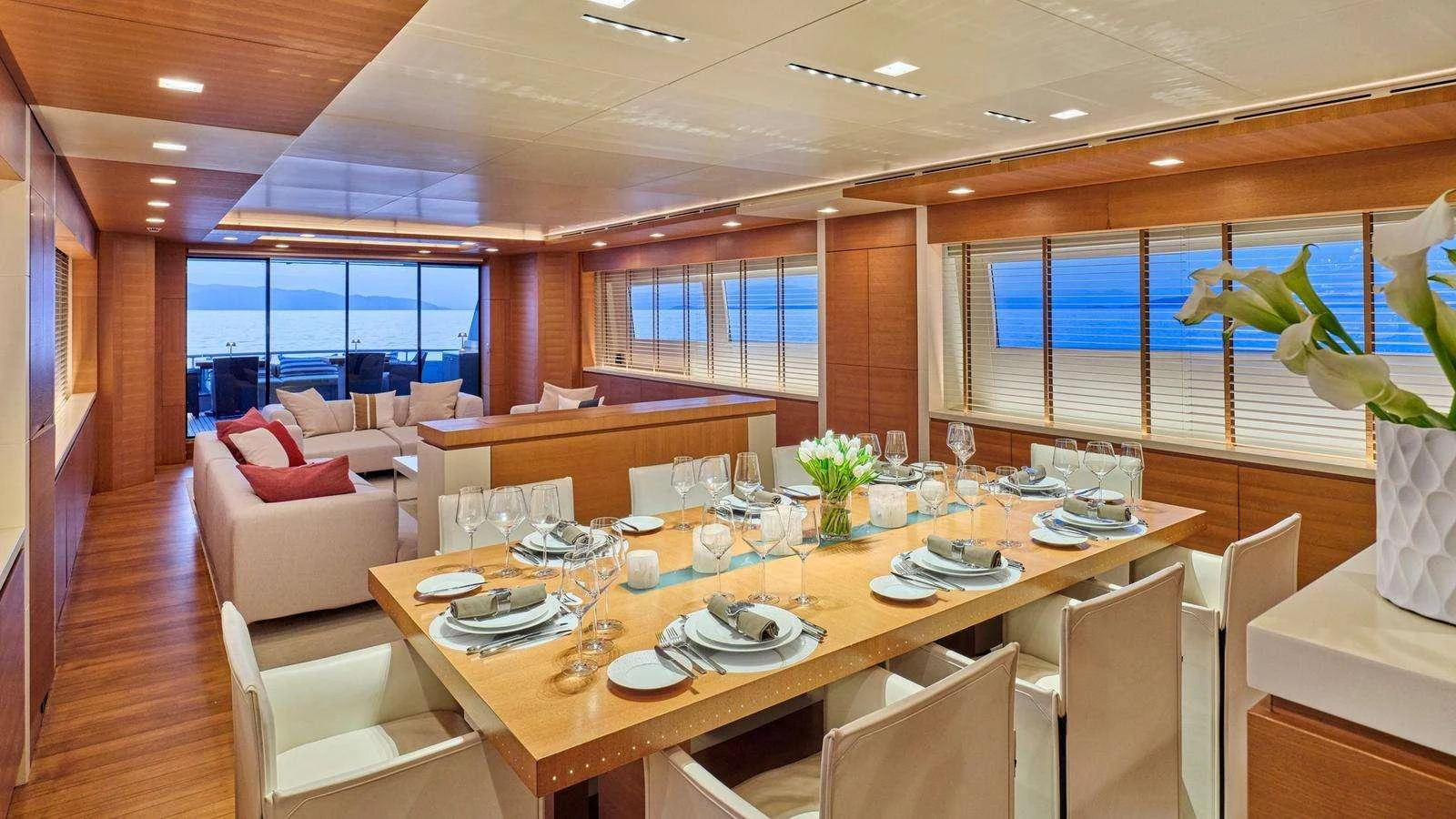 a large dining table in a room aboard KINTARO Yacht for Charter