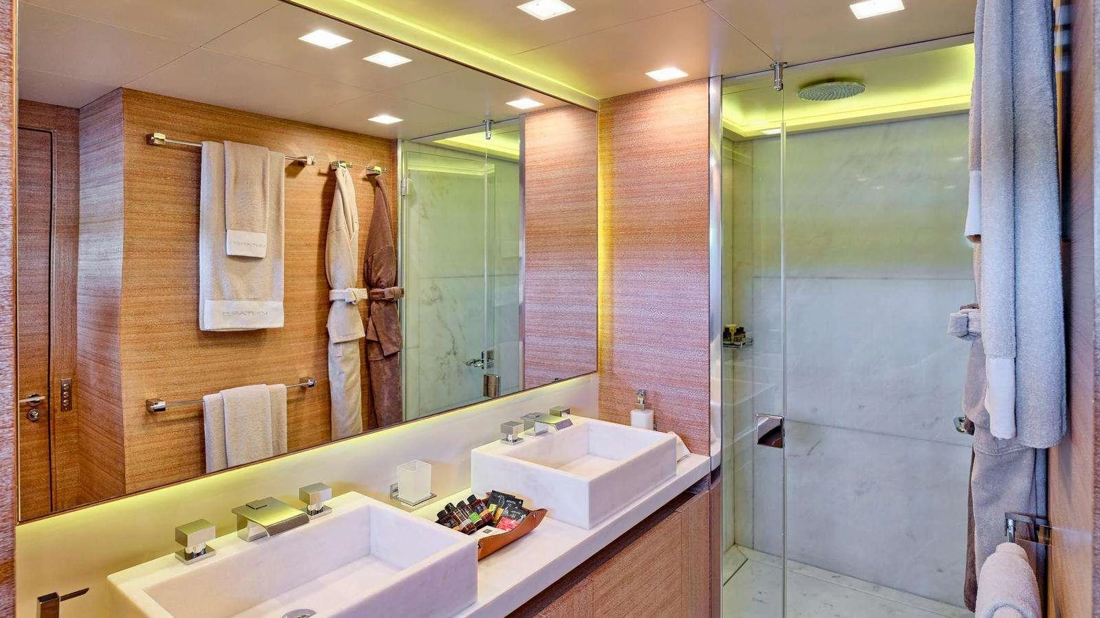 a bathroom with a large mirror aboard KINTARO Yacht for Charter