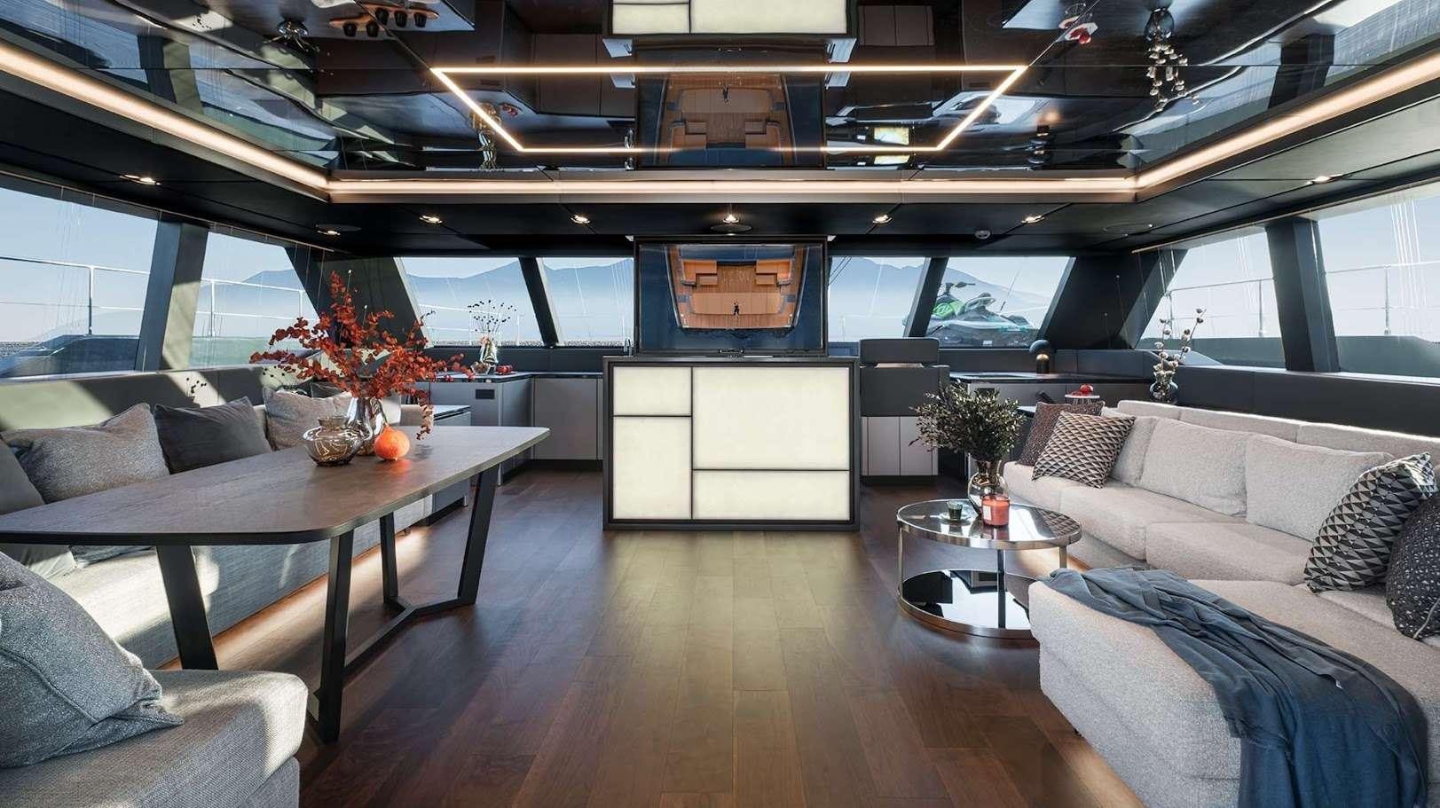 a living room with a table and couches aboard ALTEYA Yacht for Charter