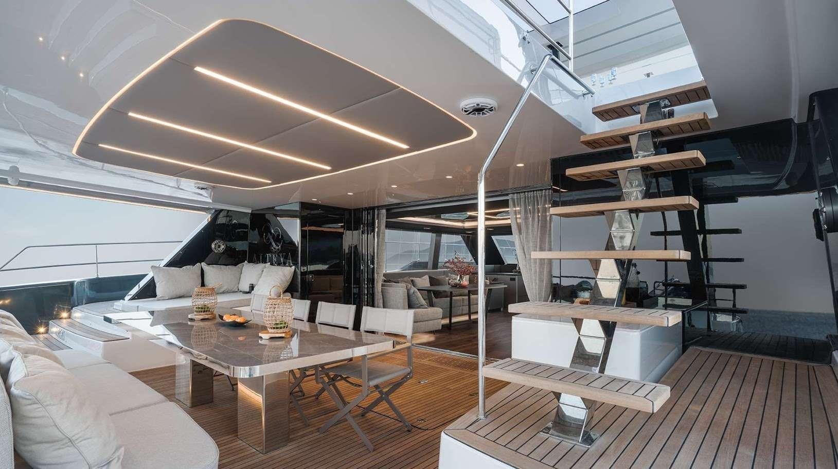 a room with a table and chairs aboard ALTEYA Yacht for Charter