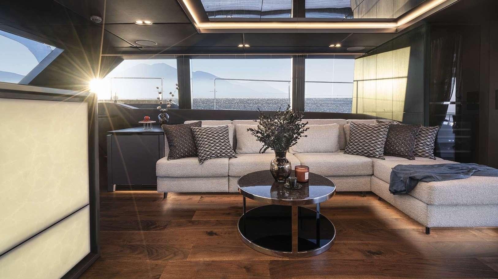 a living room with a couch and a coffee table aboard ALTEYA Yacht for Charter