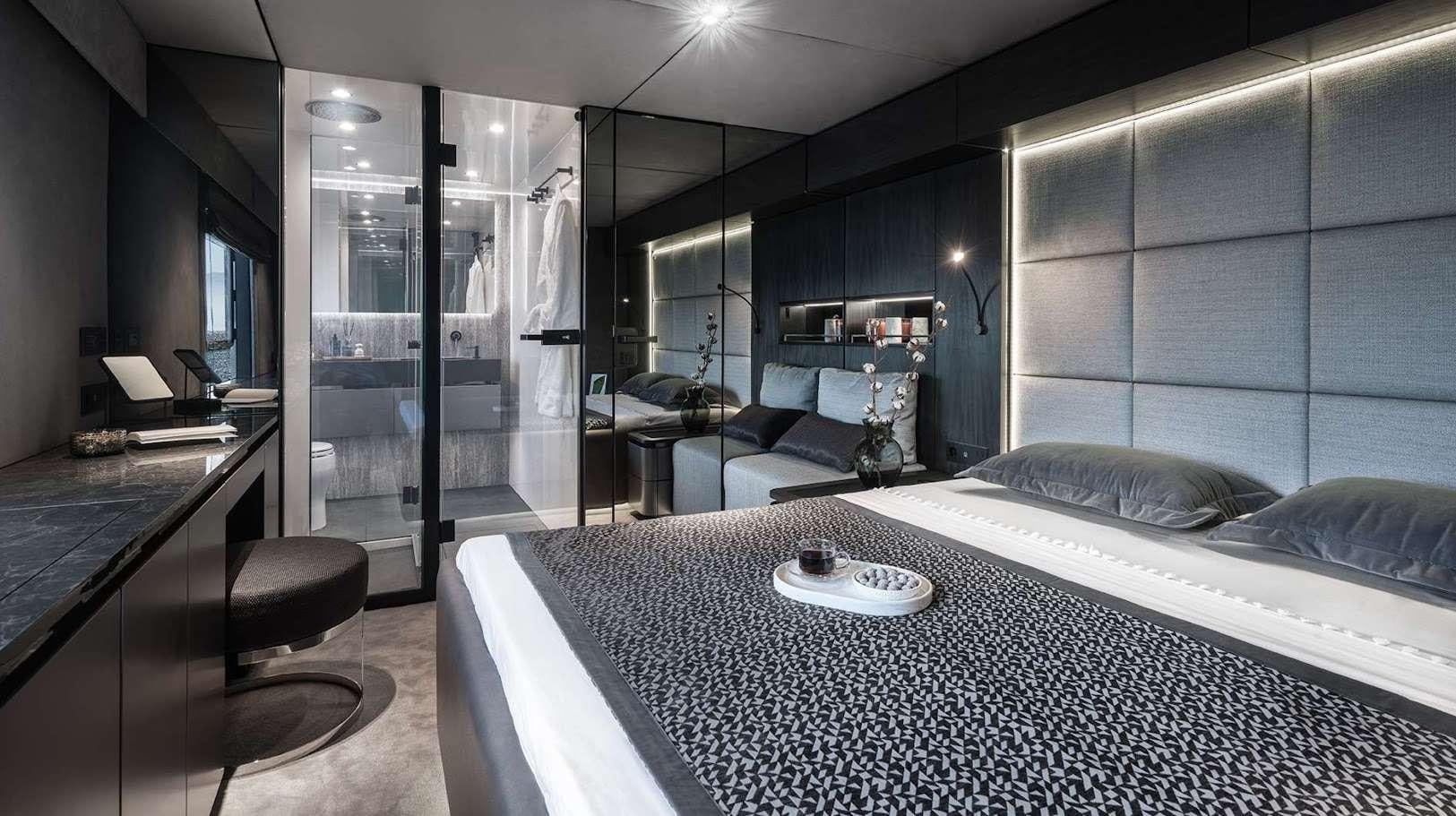 a modern bedroom with a glass wall aboard ALTEYA Yacht for Charter
