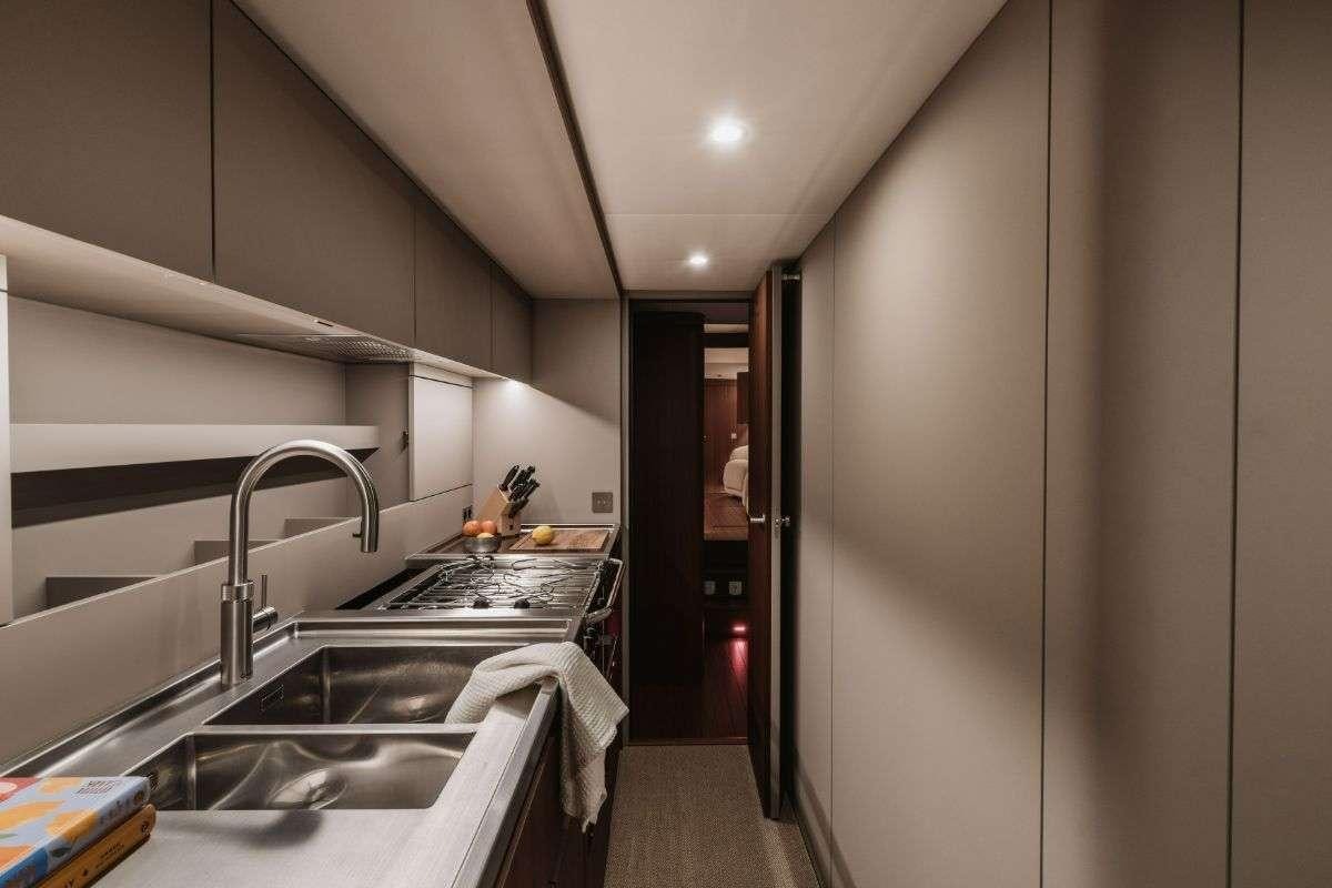 a kitchen with stainless steel appliances aboard CALABASH Yacht for Charter