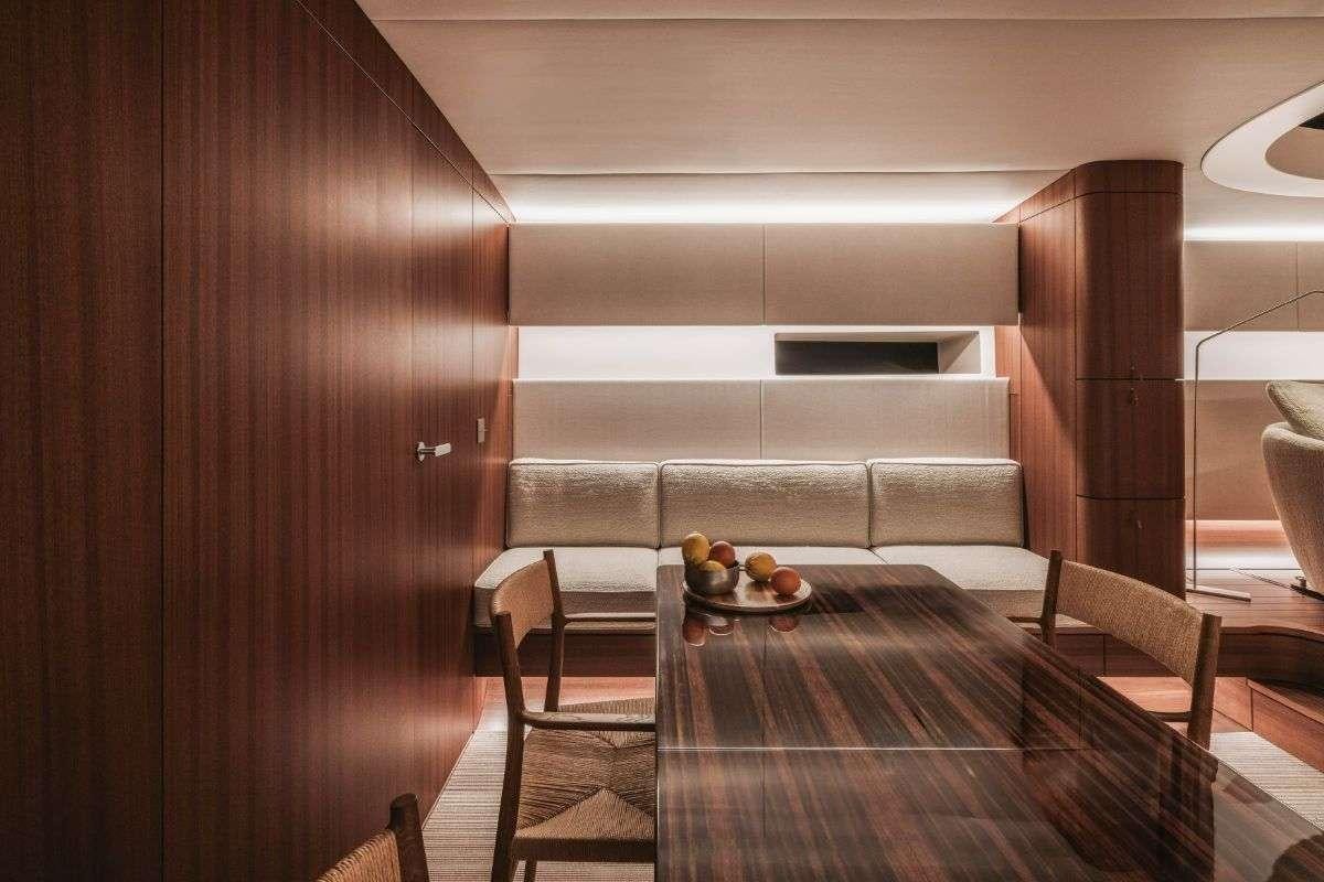 a room with a couch and a table aboard CALABASH Yacht for Charter