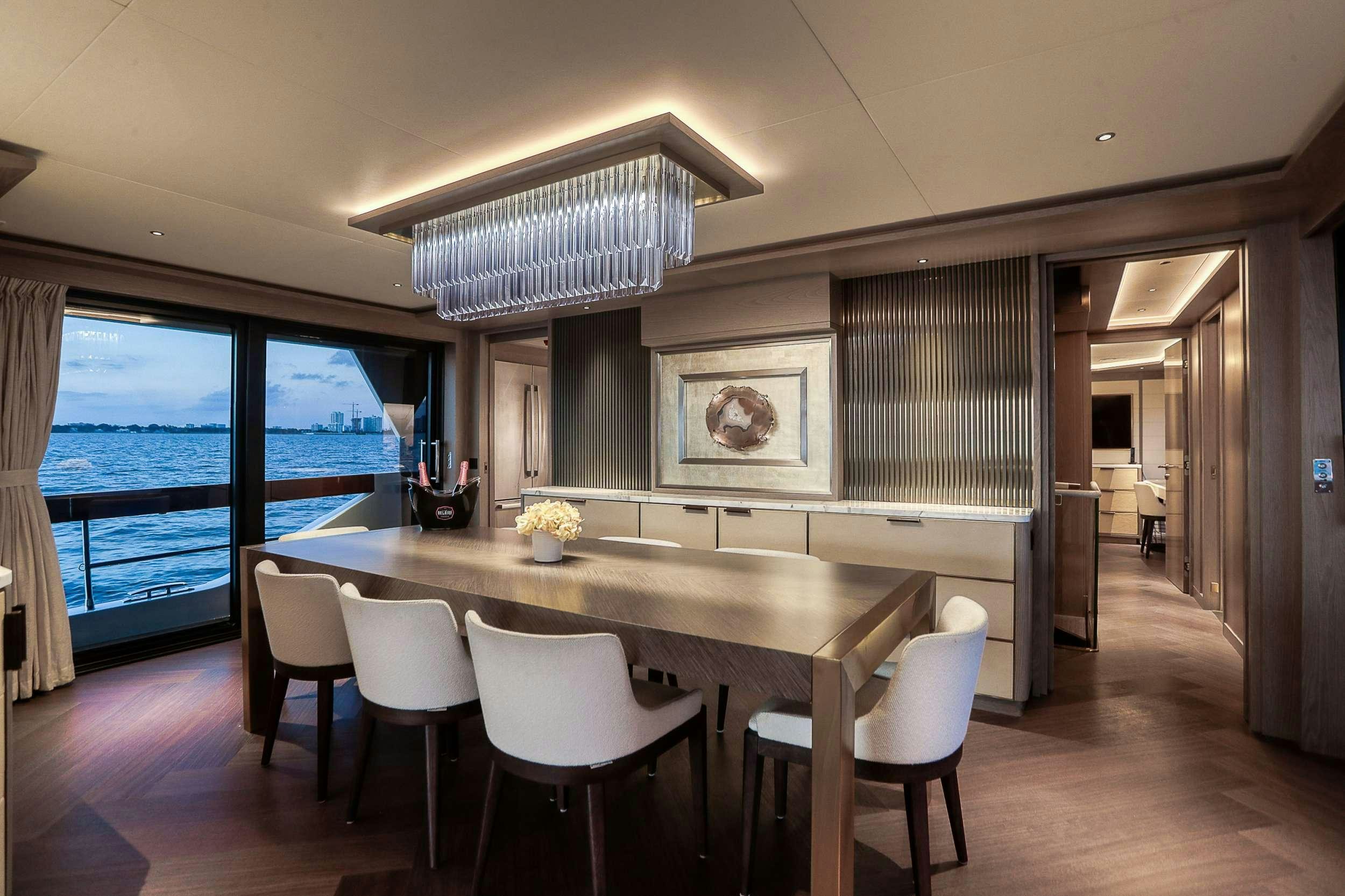 a large kitchen with a table and chairs aboard SAINT Yacht for Charter