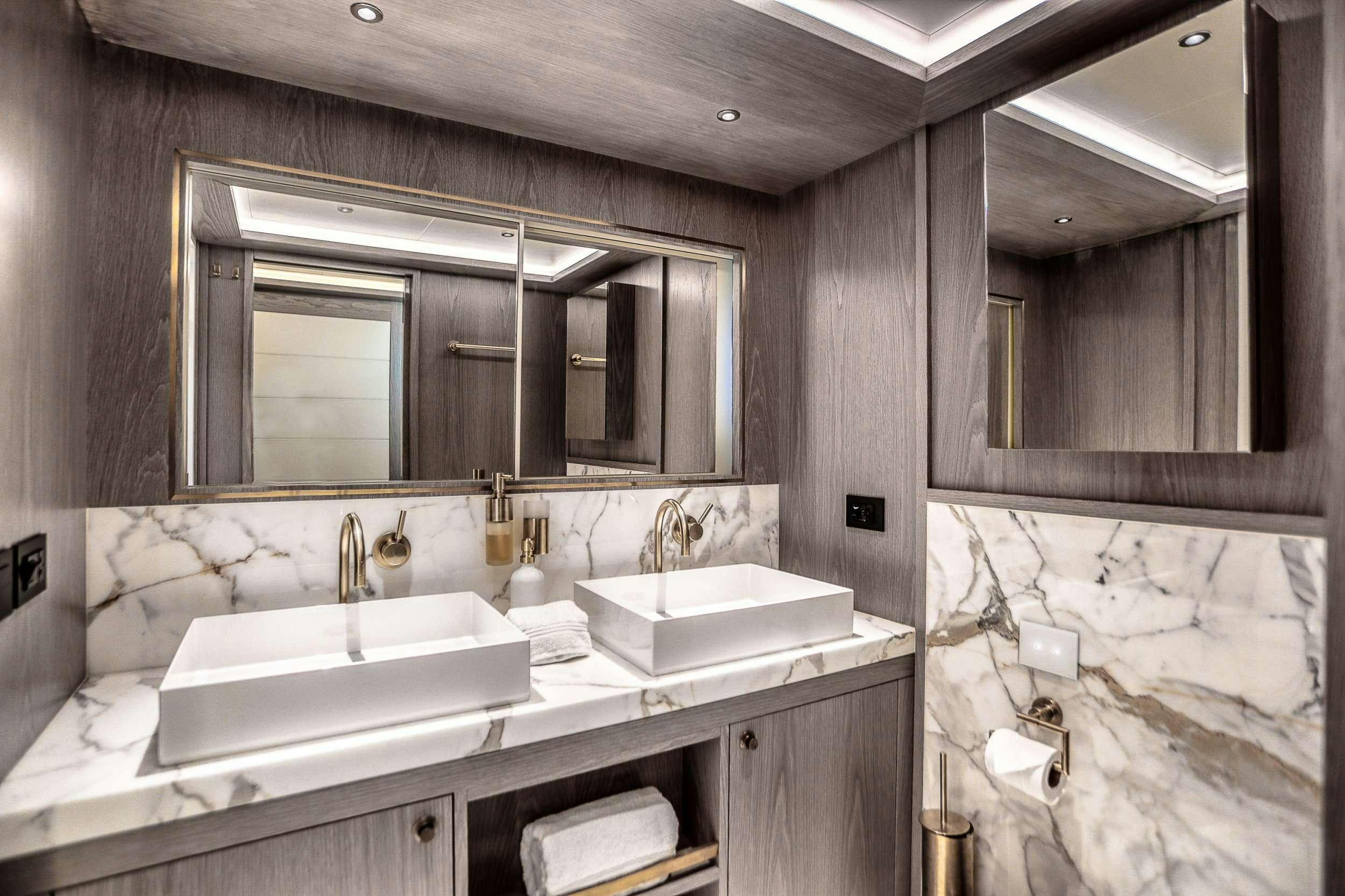 a bathroom with sinks and mirrors aboard SAINT Yacht for Charter