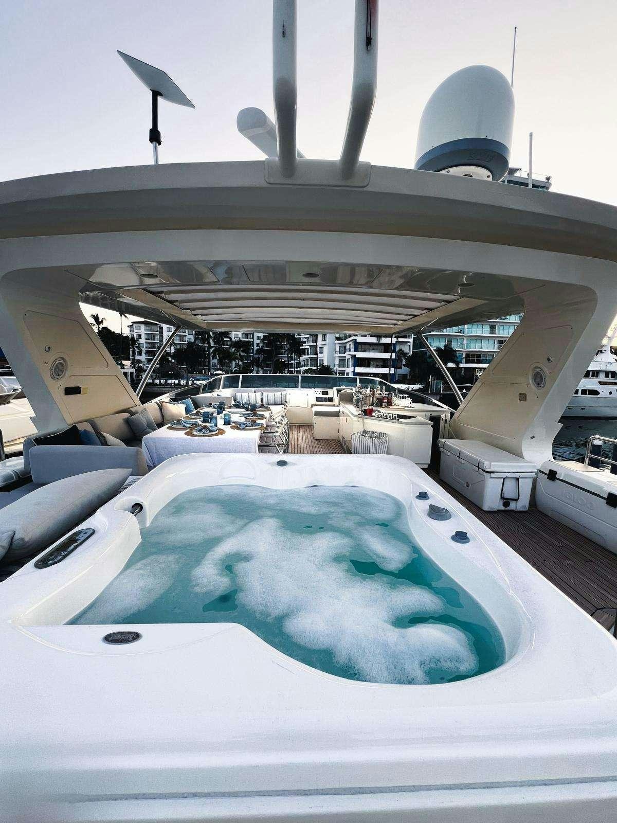 a large pool with a large fan aboard EL GABO Yacht for Charter