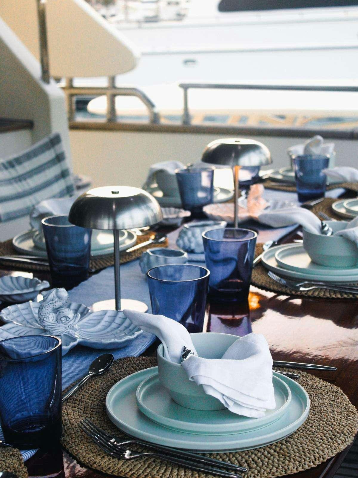 a table with a tea set aboard EL GABO Yacht for Charter