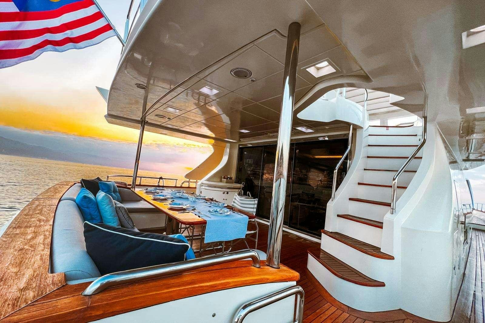 a tent with a flag on the side aboard EL GABO Yacht for Charter