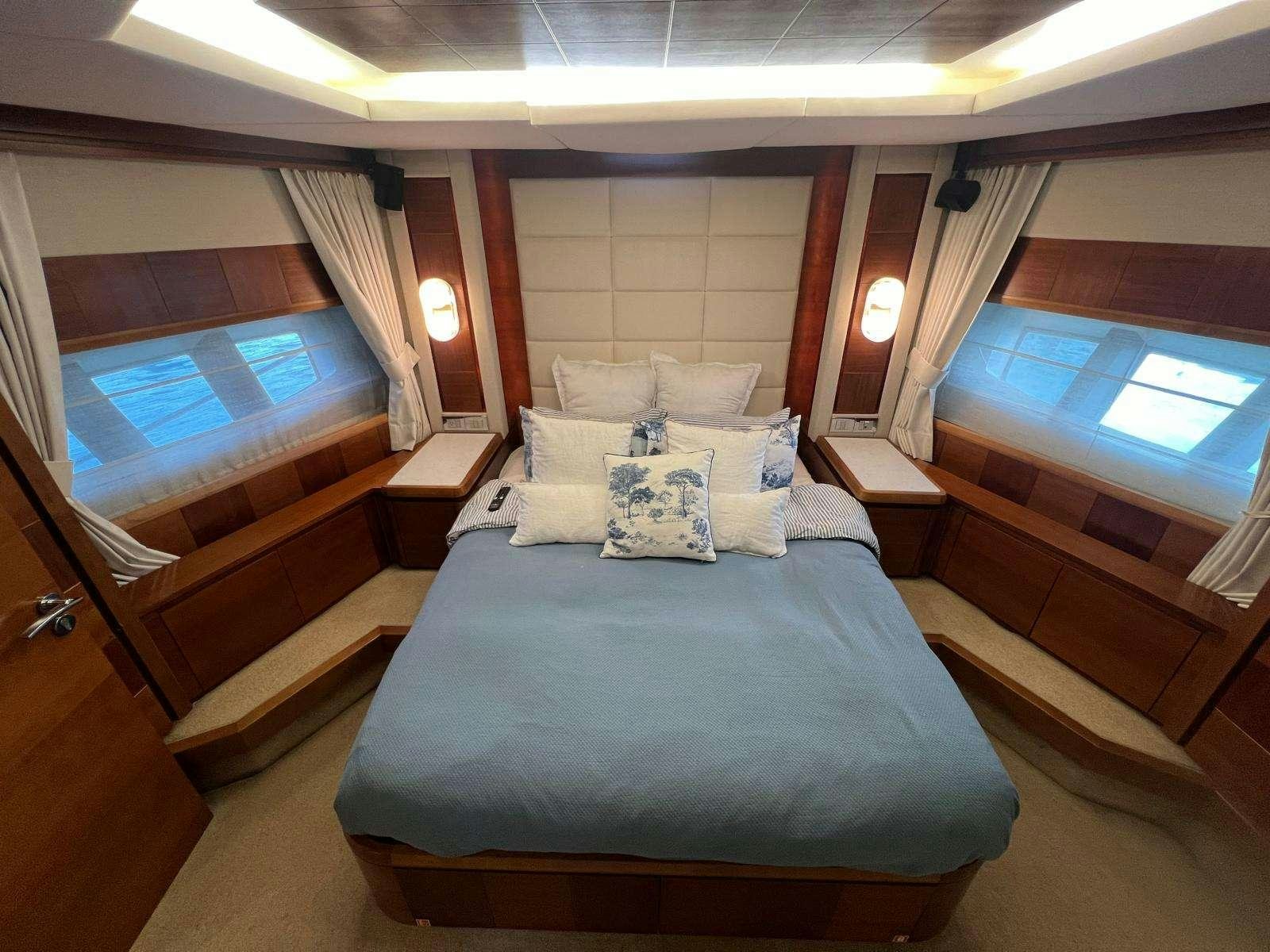 a bed in a room aboard EL GABO Yacht for Charter