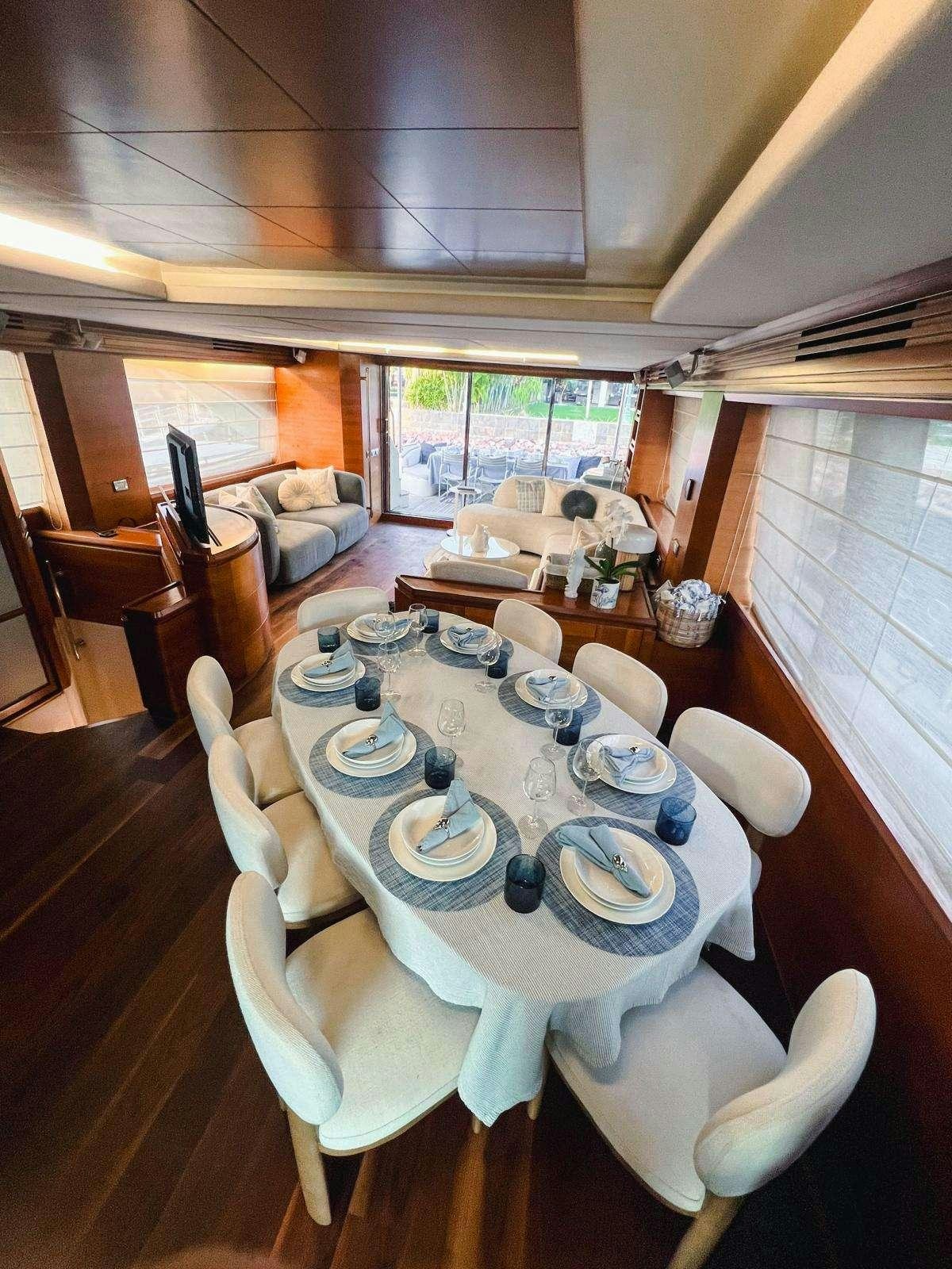 a dining room with a table set aboard EL GABO Yacht for Charter