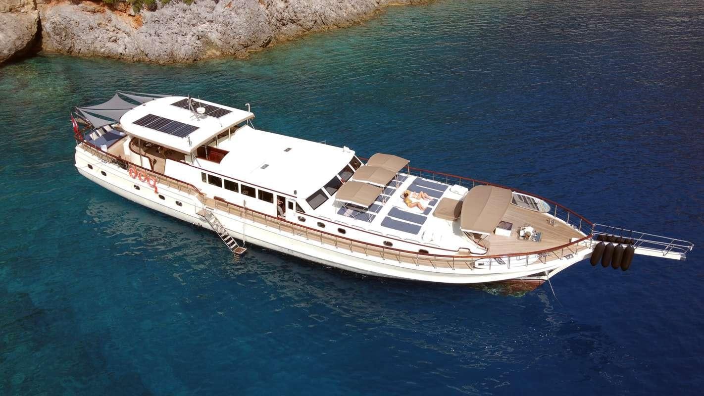 a white and black boat on water aboard ALWAYS SMILE Yacht for Charter